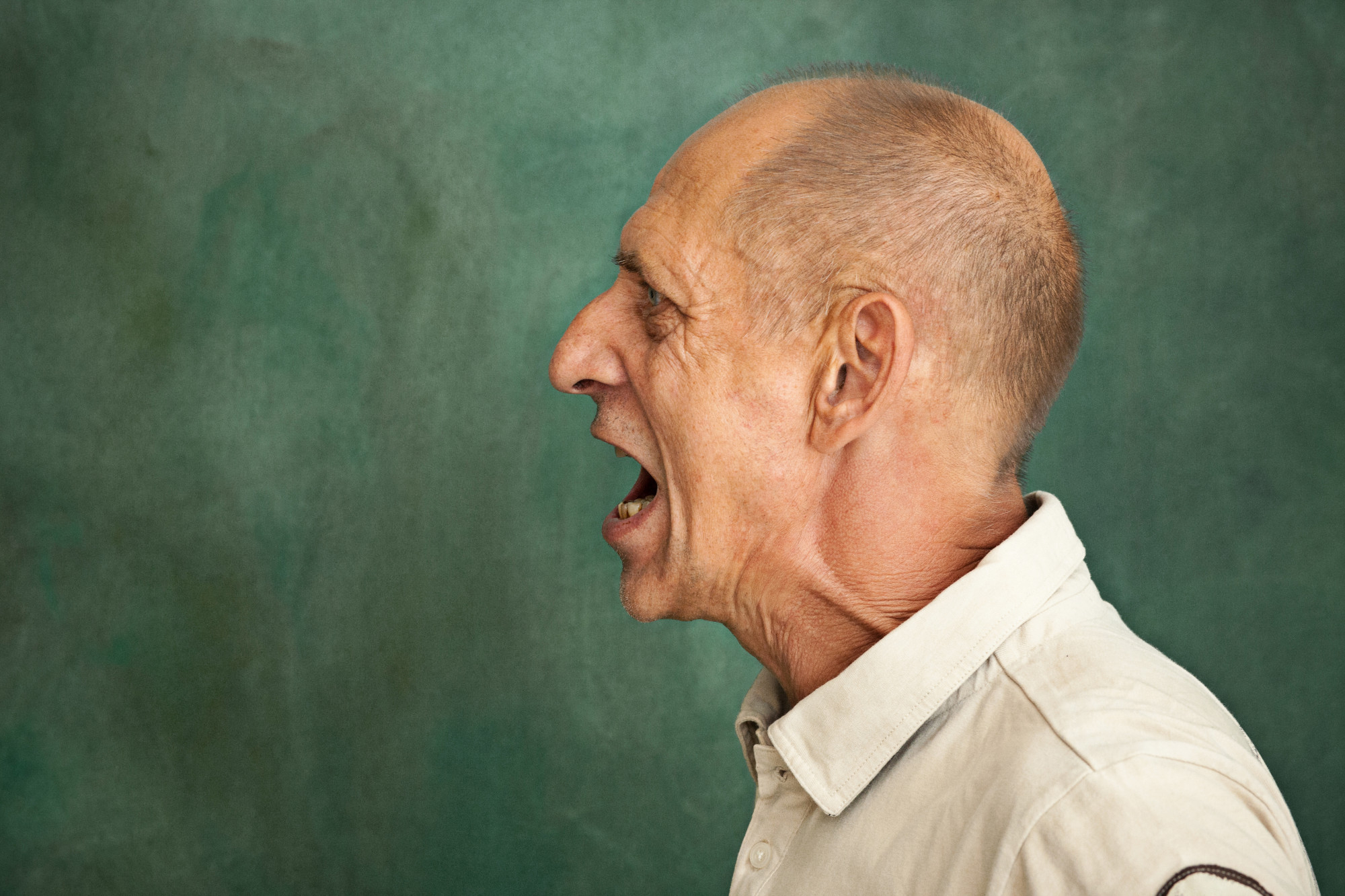 An upset man shouting | Source: Freepik