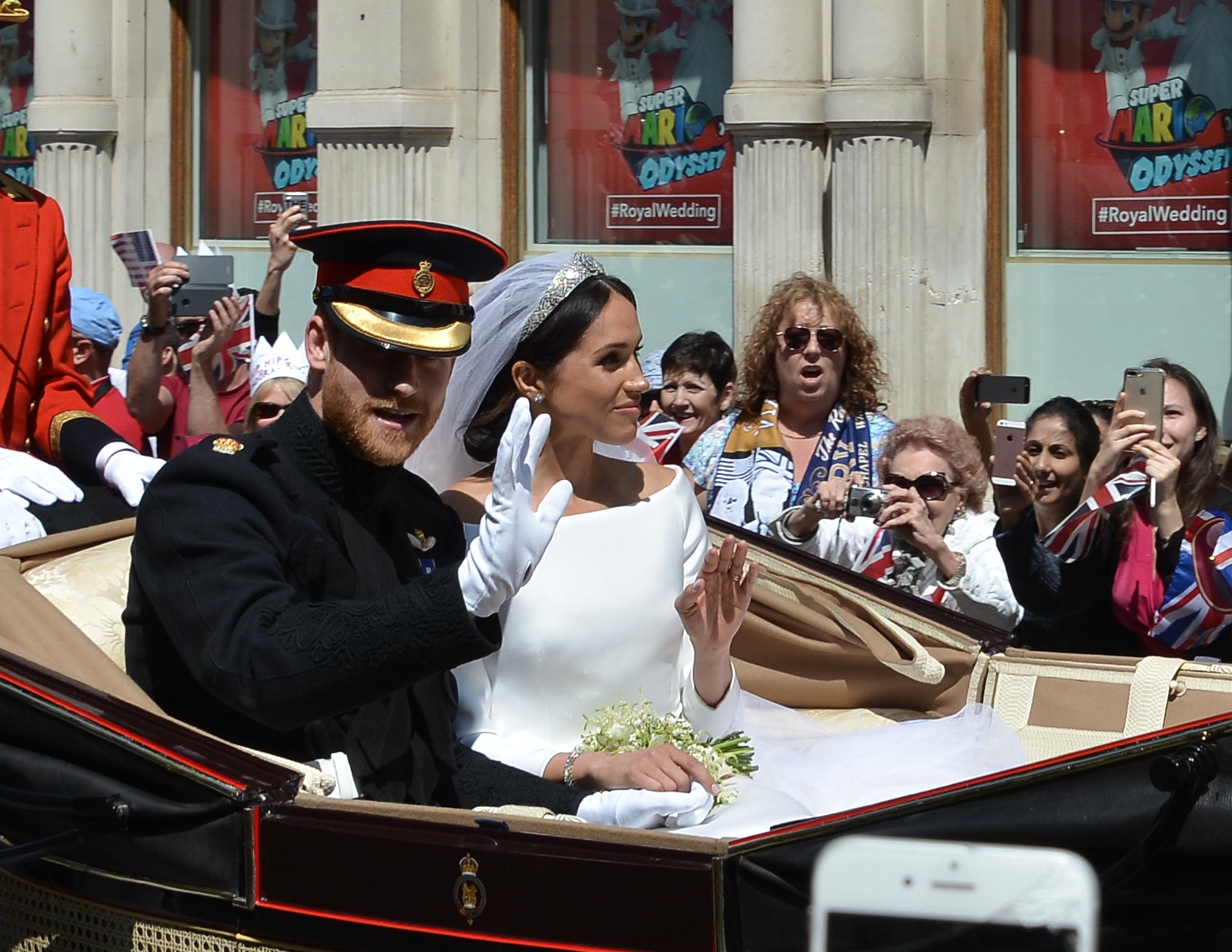 Prince Harry and Meghan Markle outside St. George's Cathedral on the day of their wedding in Windsor, England on May 19, 2018 | Source: Getty Images