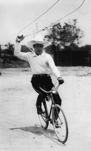 Tom Mix seen riding a bicycle on June 19th 1933. | Photo: Getty Images