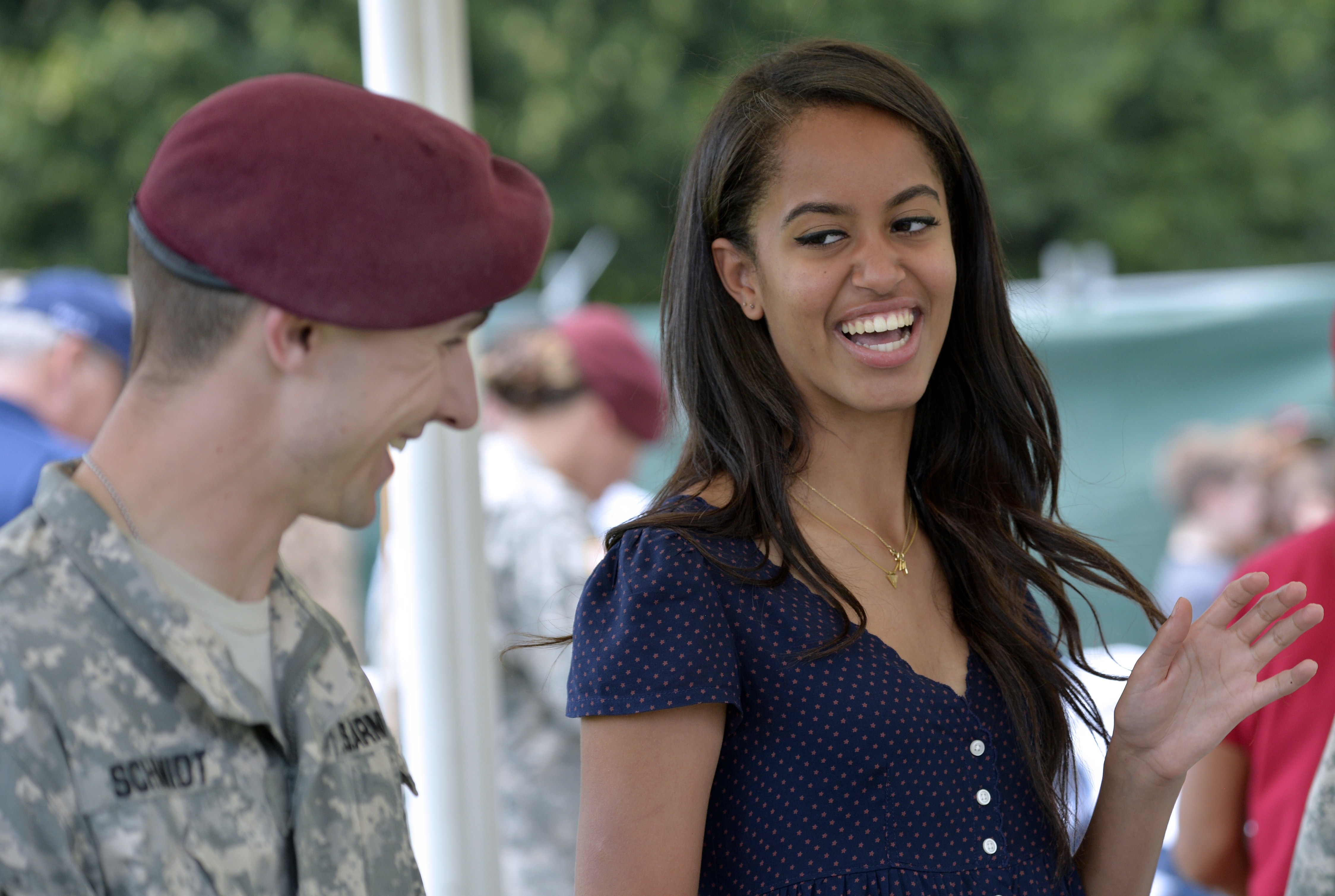Malia Obama smiles as she serves food during a lunch at the United States and Nato military base in Vicenza on June 19, 2015. | Source: Getty Images