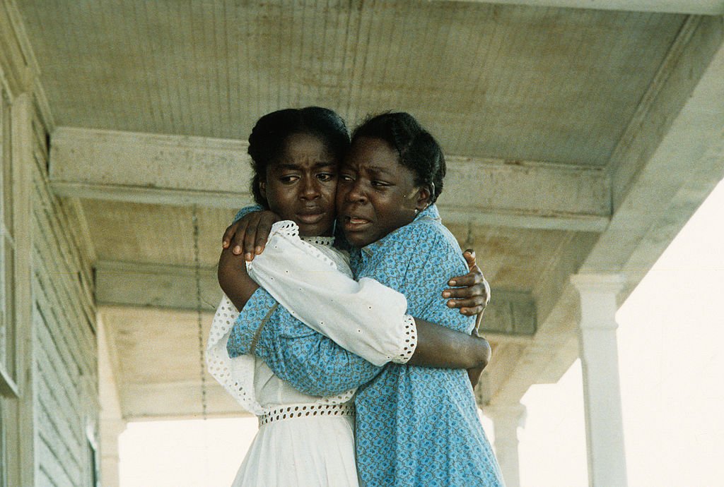 Akosua Busia and Desreta Jackson embrace in an emotional scene in the film "The Color Purple," 1985.| Source: Getty Images