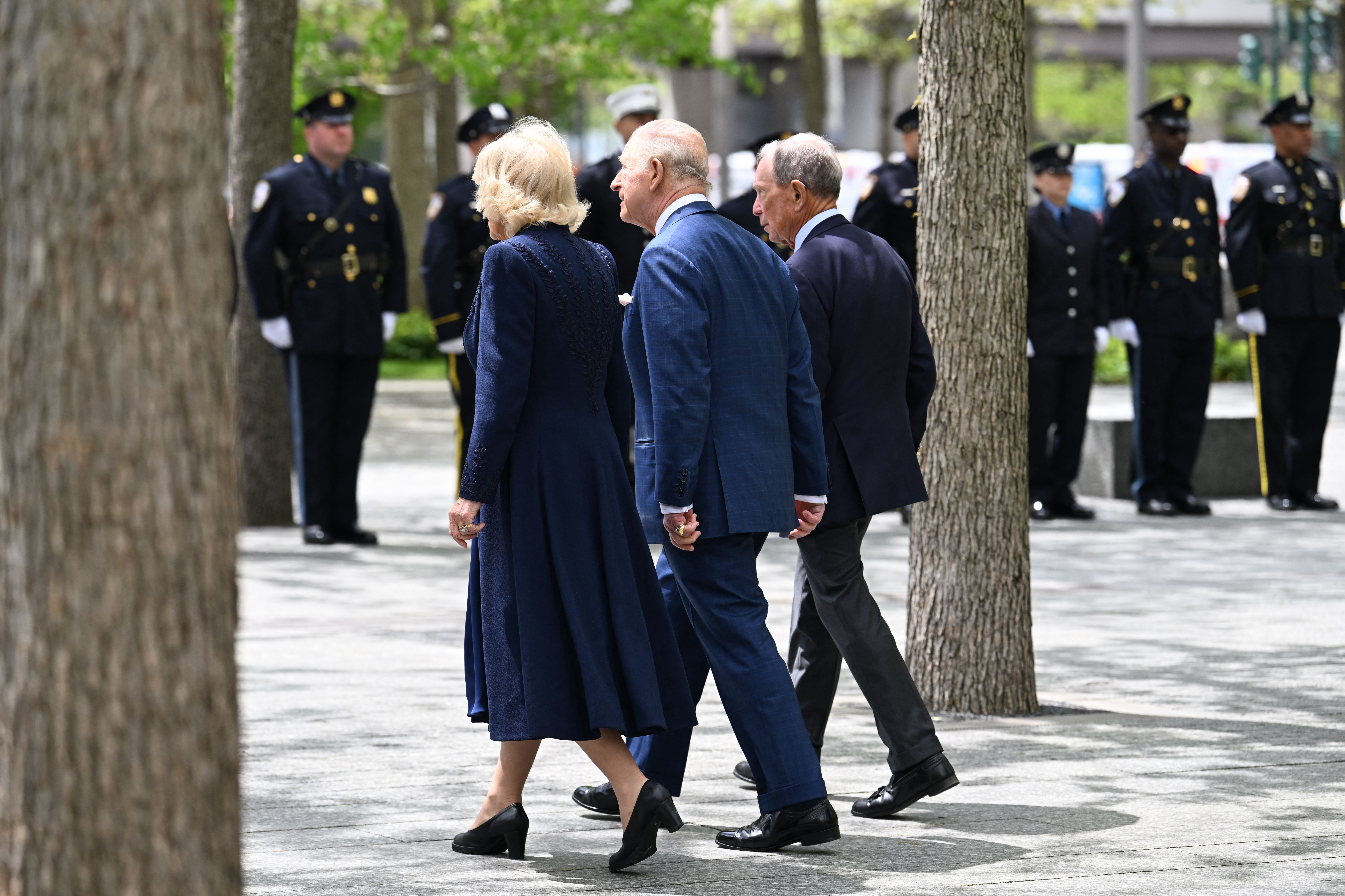 King Charles III and Queen Camilla walk through the 9/11 Memorial alongside Michael Bloomberg in New York City on April 29, 2026 | Source: Getty Images