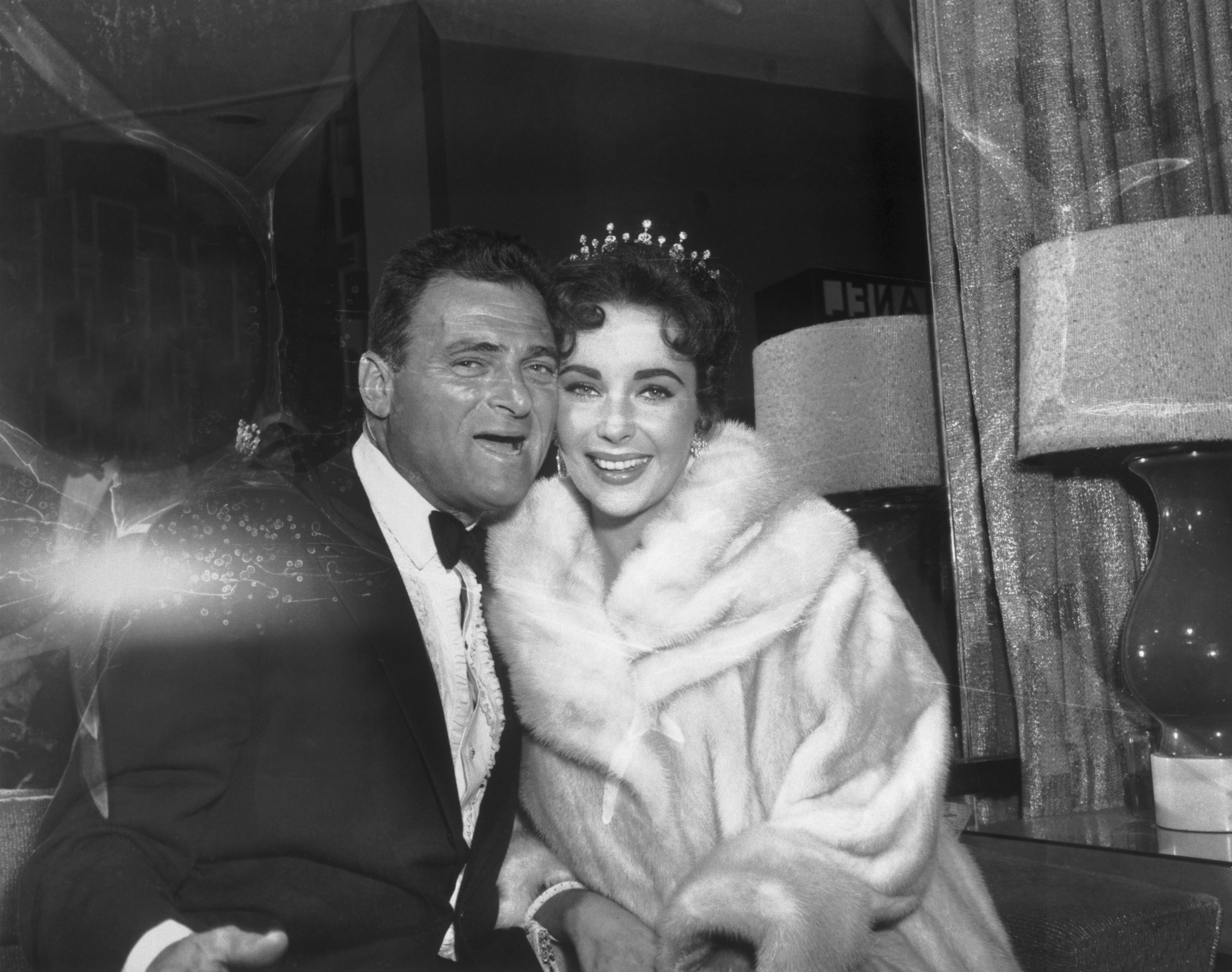 Actor Mike Todd and his wife, Elizabeth Taylor as they arrive at a party after the Academy Award presentations. / Source: Getty Images