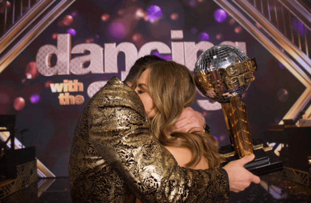 Alan Bersten and Hannah Brown hug as they are announced the winners for season 28 of "Dancing with the Stars," on November 25, 2019 | Source: Eric McCandless via Getty Images