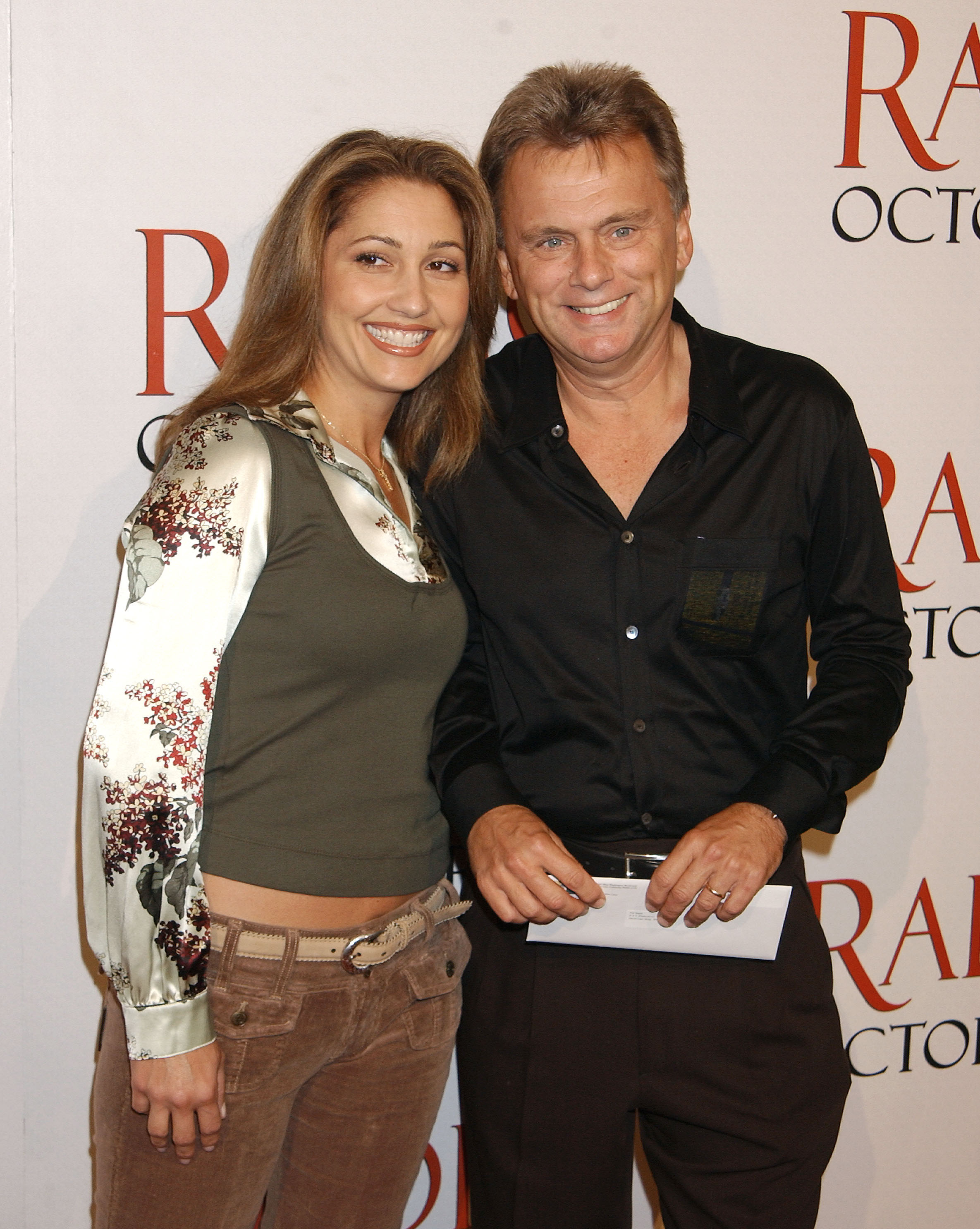 Pat Sajak and Lesly Brown at the "Radio" premiere in October 2003 | Source: Getty Images