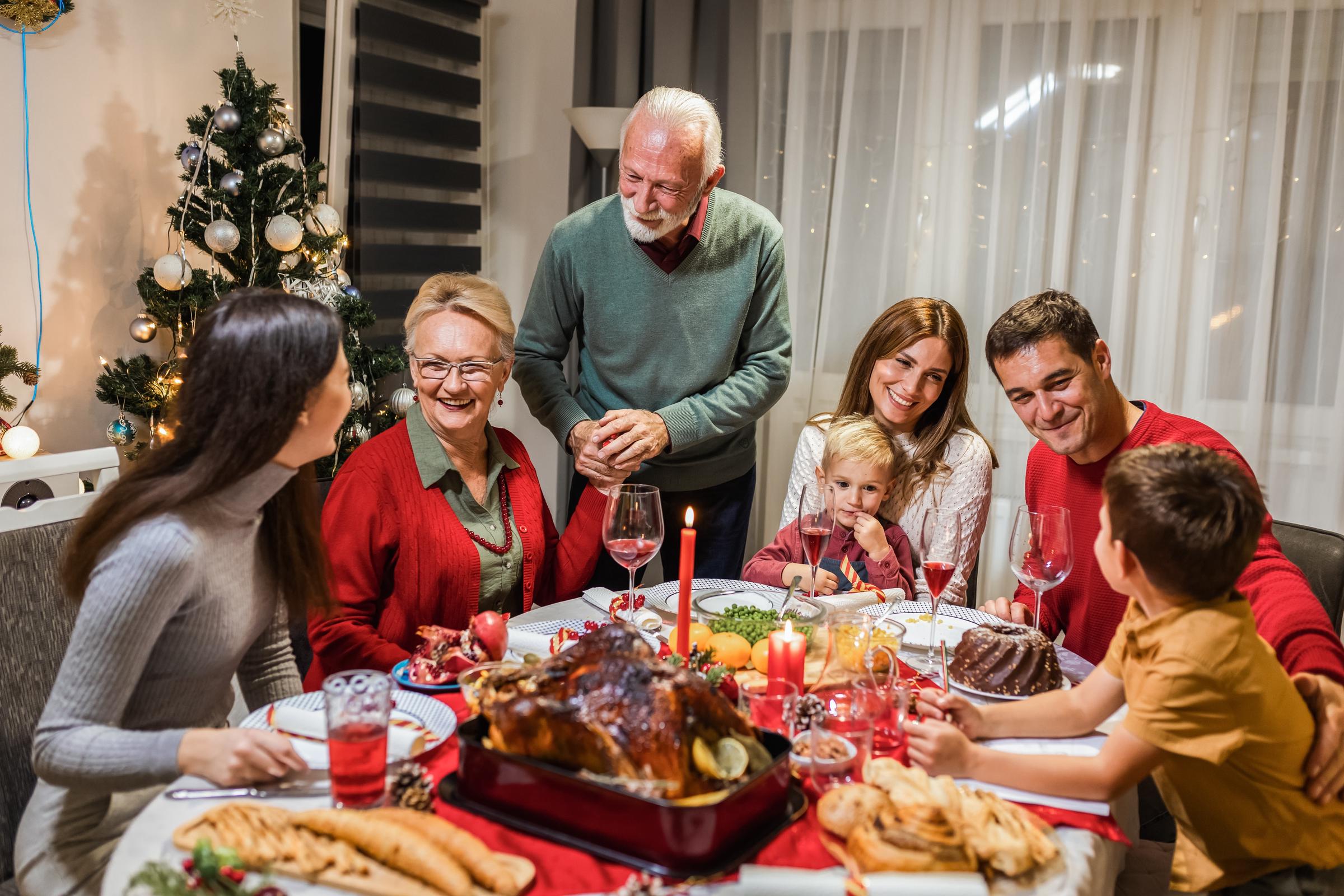 A family enjoying a quiet Christmas meal | Source: Shutterstock