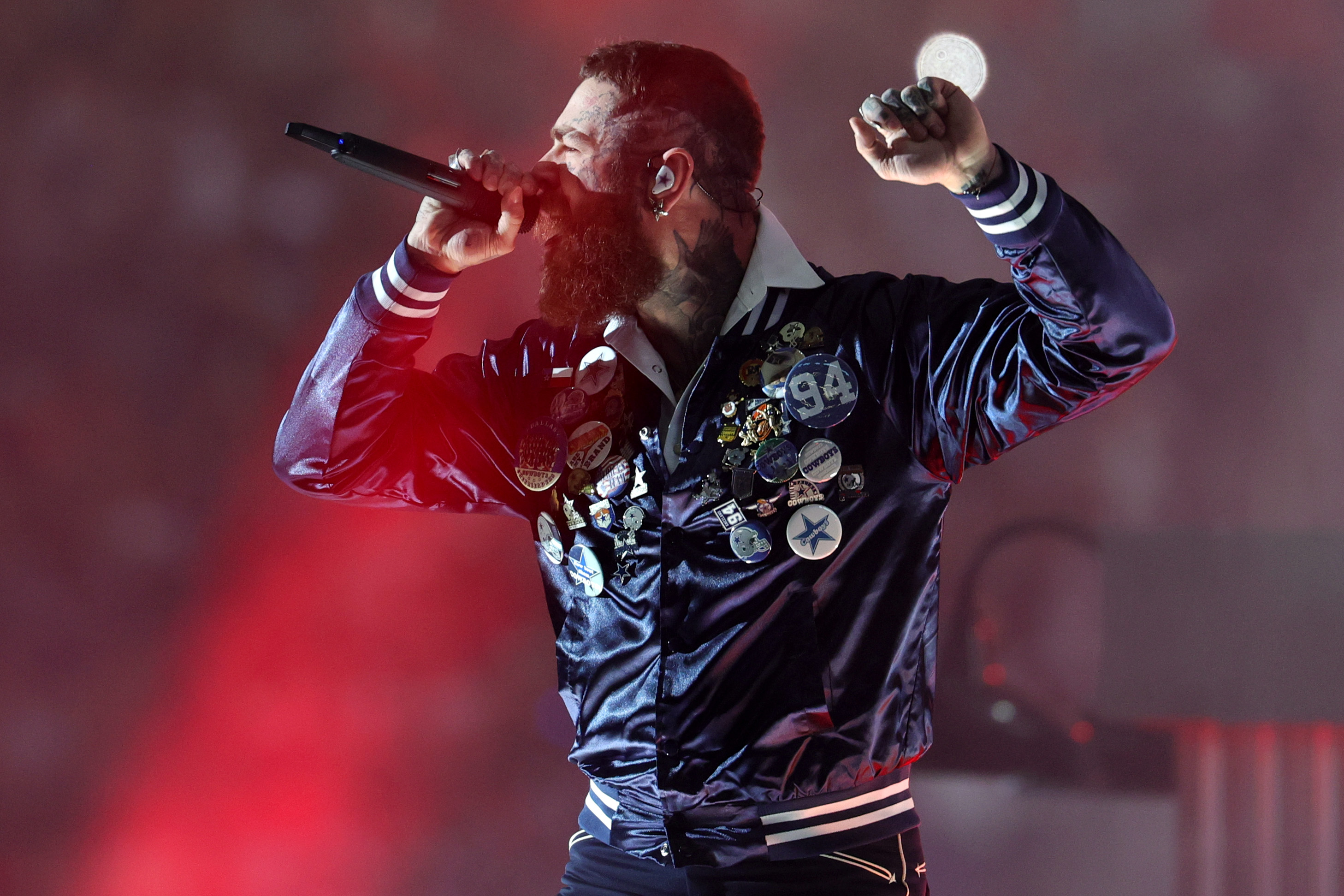 Post Malone performs at halftime during the Dallas Cowboys–Kansas City Chiefs game in Arlington, Texas, on November 27, 2025 | Source: Getty Images