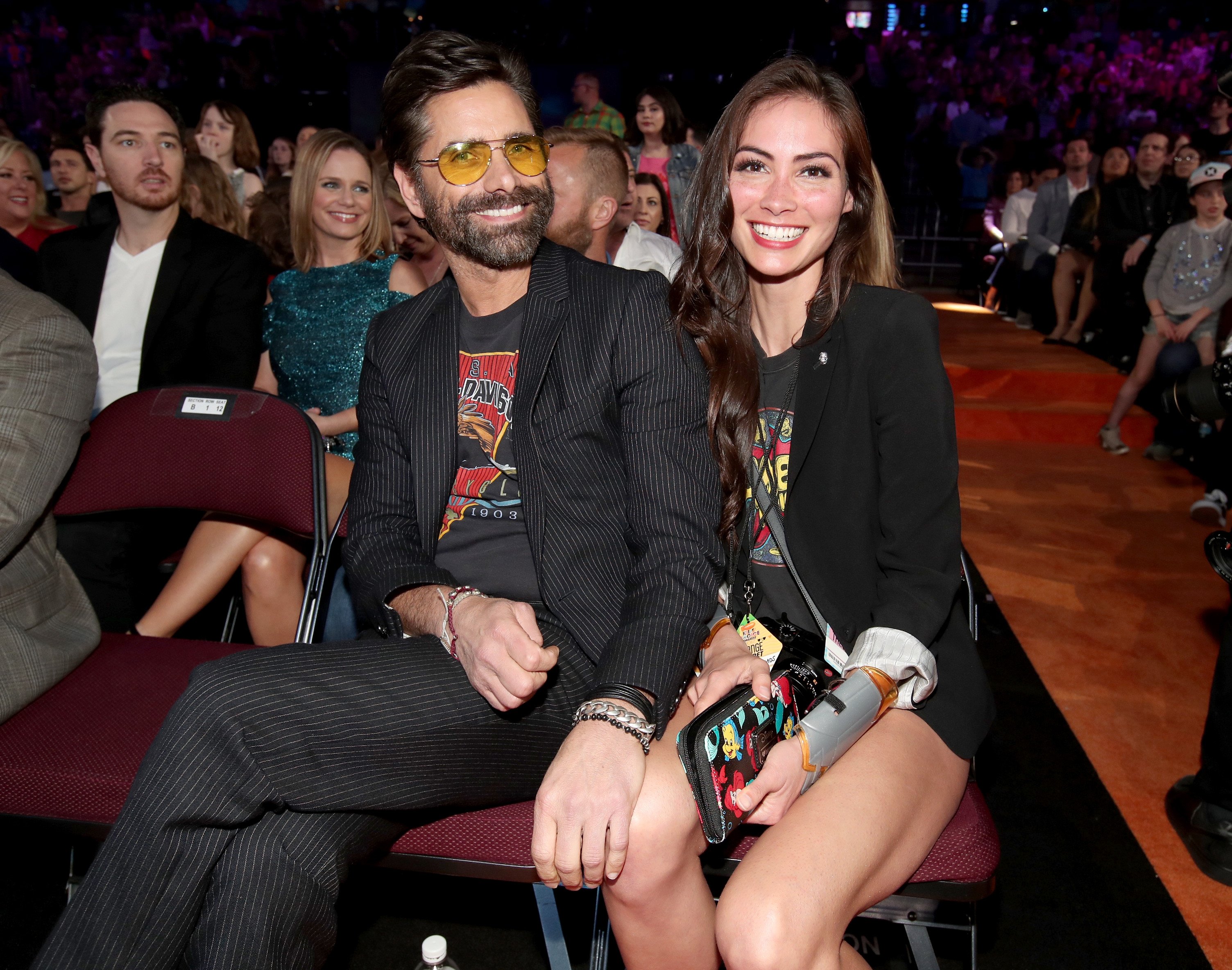  Actor John Stamos (L) and Caitlin McHugh at Nickelodeon's 2017 Kids' Choice Awards at USC Galen Center on March 11, 2017| Photo: Getty Images