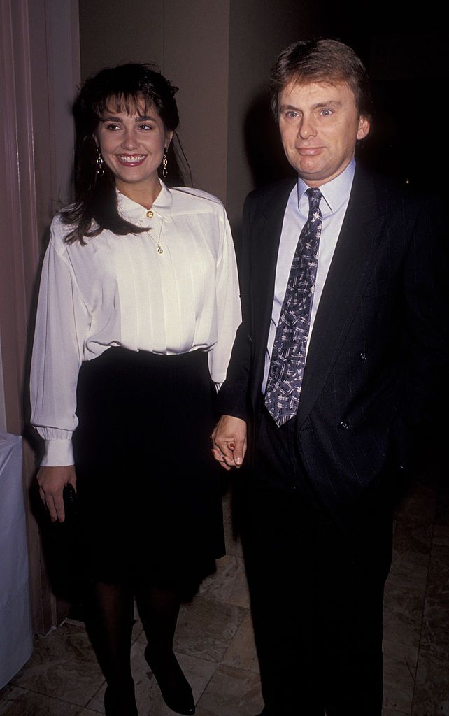 Lesly Brown and Pat Sajak at the "Toys for Tots Benefit" on December 12, 1990, in Beverly Hills, California. | Source: Ron Galella, Ltd./Ron Galella Collection/Getty Images