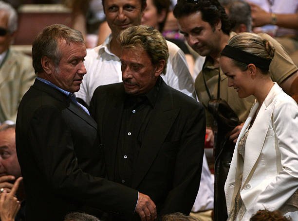 Yves Rénier et Johnny Hallyday| Photo : Getty Images