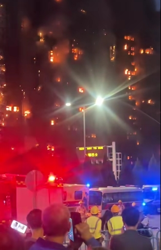 Ambulances and fire engines fill the street as residents watch in horror while two towers burn side by side. The inferno, declared a Level 5 alarm — the highest possible — has claimed at least 55 lives and left hundreds missing in what is now Hong Kong's worst fire disaster in more than 30 years. | Source: TikTok/highlight_kutin