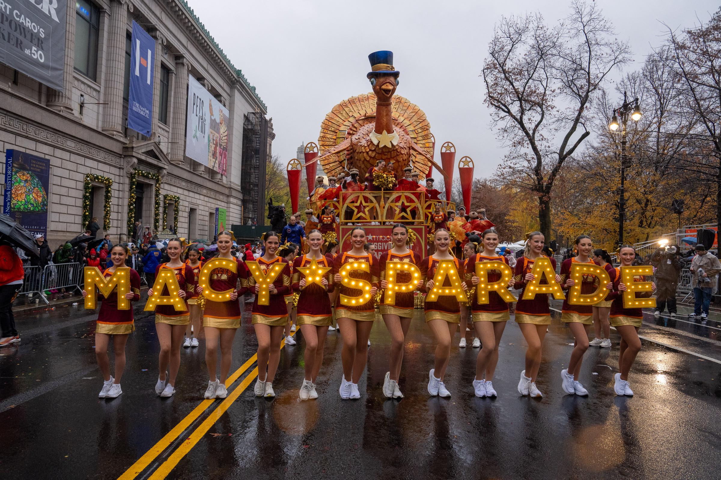 Cheerleaders perform in the rain during the annual Macy's Thanksgiving Day Parade in New York City on November 28, 2024 | Source: Getty Images