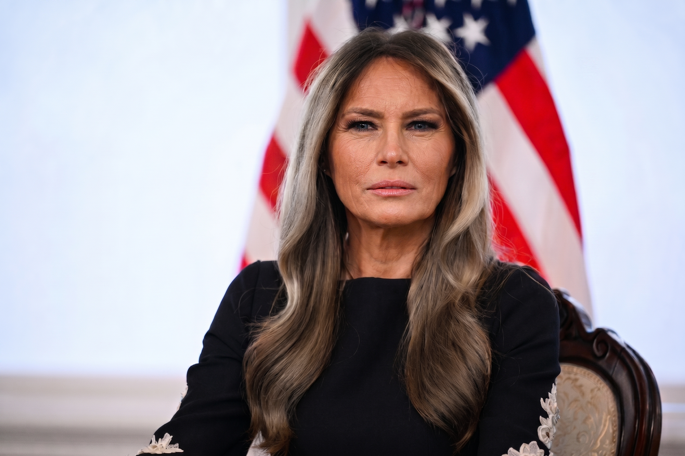 An AI-created image shows a mature-looking version of Trump seated in a formal setting. The rendering emphasizes age-related skin texture and facial lines while maintaining her recognizable features. | Source: Gemini