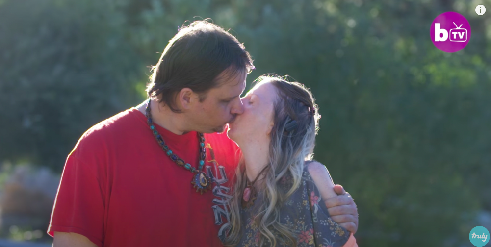 A screenshot of Cynthia and her husband Thane sharing a tender kiss from a video posted on December 19, 2017 | Source: YouTube.com/truly