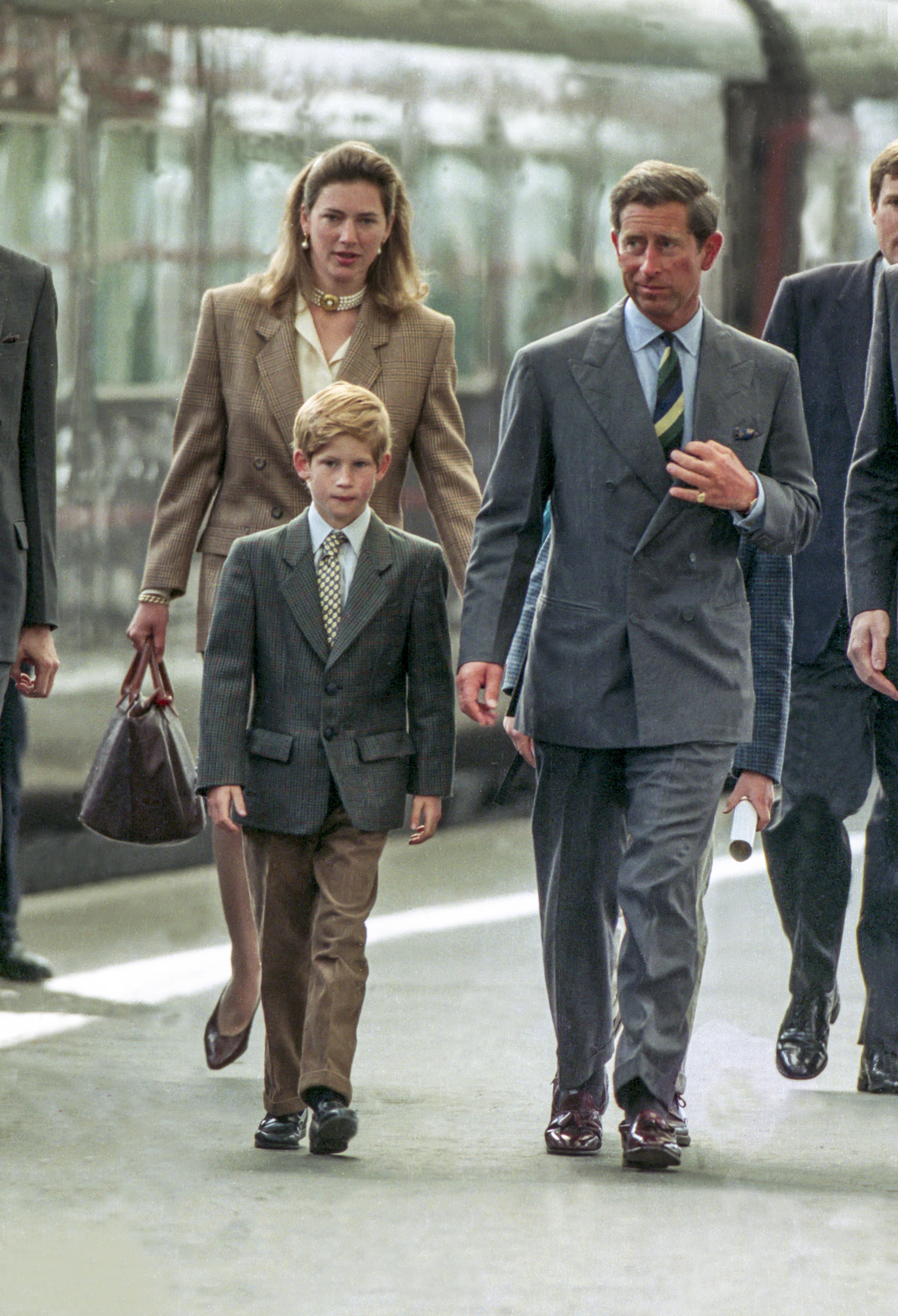Charles, Prince of Wales, and Prince Harry, with nanny, Tiggy Legge Bourke, arrive at Aberdeen Railway Station on August 17, 1993 in Aberdeen, Scotland | Photo: Getty Images