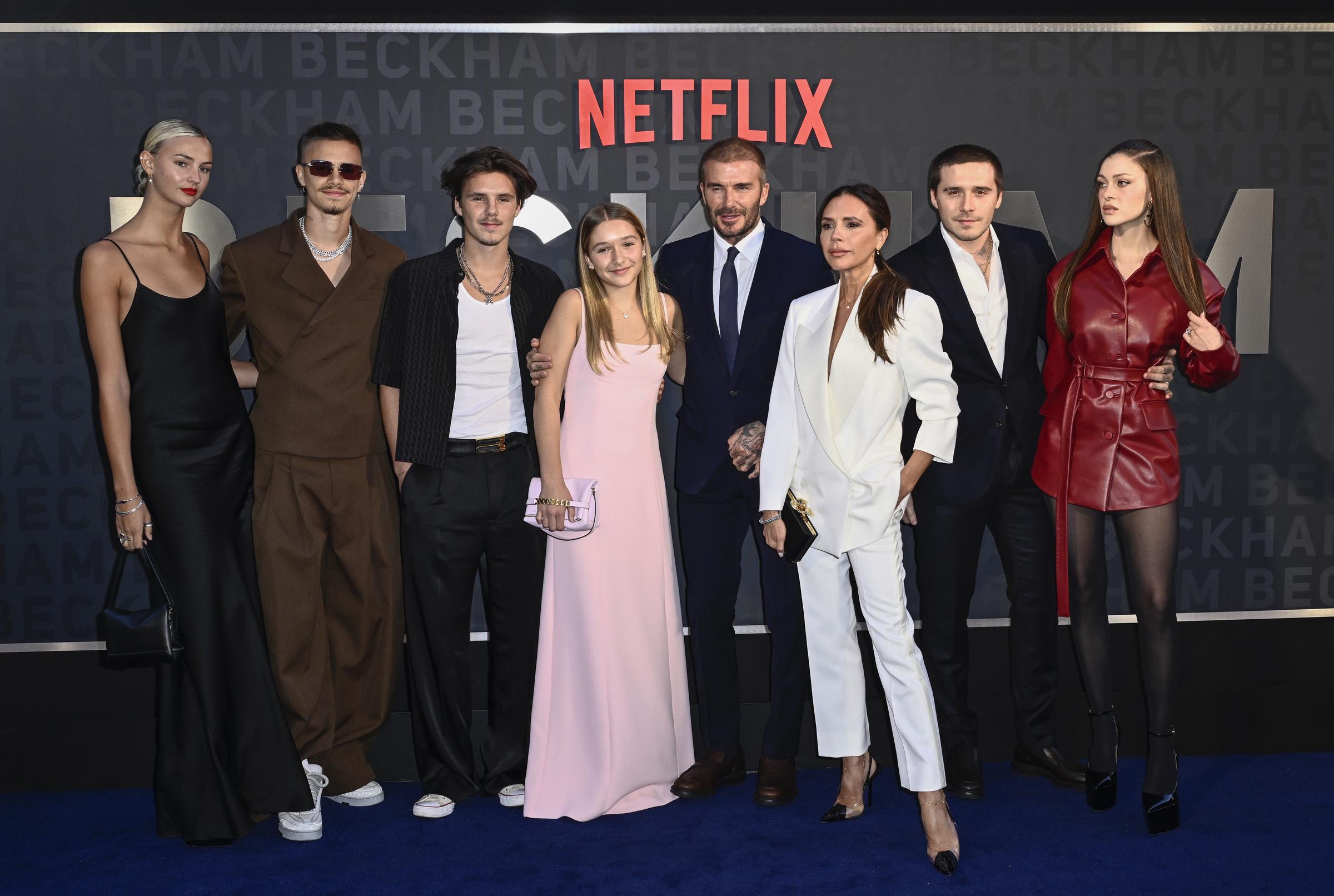 Mia Regan, Romeo Beckham, Cruz Beckham, Harper Beckham, David Beckham, Victoria Beckham, Brooklyn Peltz Beckham, and Nicola Peltz Beckham at the Netflix "Beckham" UK premiere on October 3, 2023, in London, England. | Source: Getty Images
