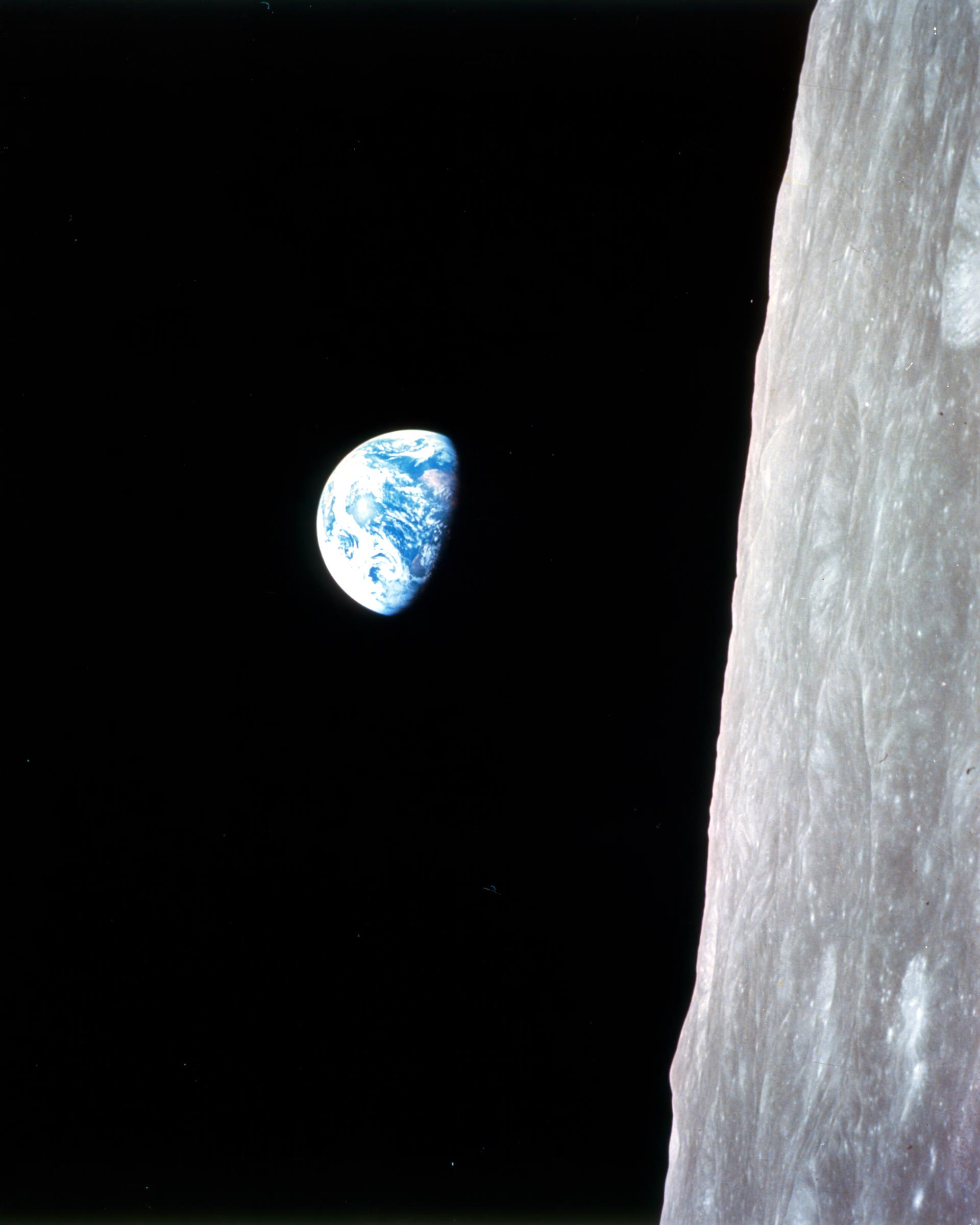 The Earth rises above the lunar horizon, photographed by astronaut Bill Anders during the Apollo 8 mission on Christmas Eve, 1968. | Source: Getty Images