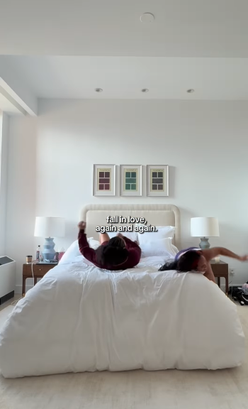 Simone Johnson and Tatyanna Dumas on a bed together, from a post dated December 7, 2025 | Source: Instagram/bigupsofficial