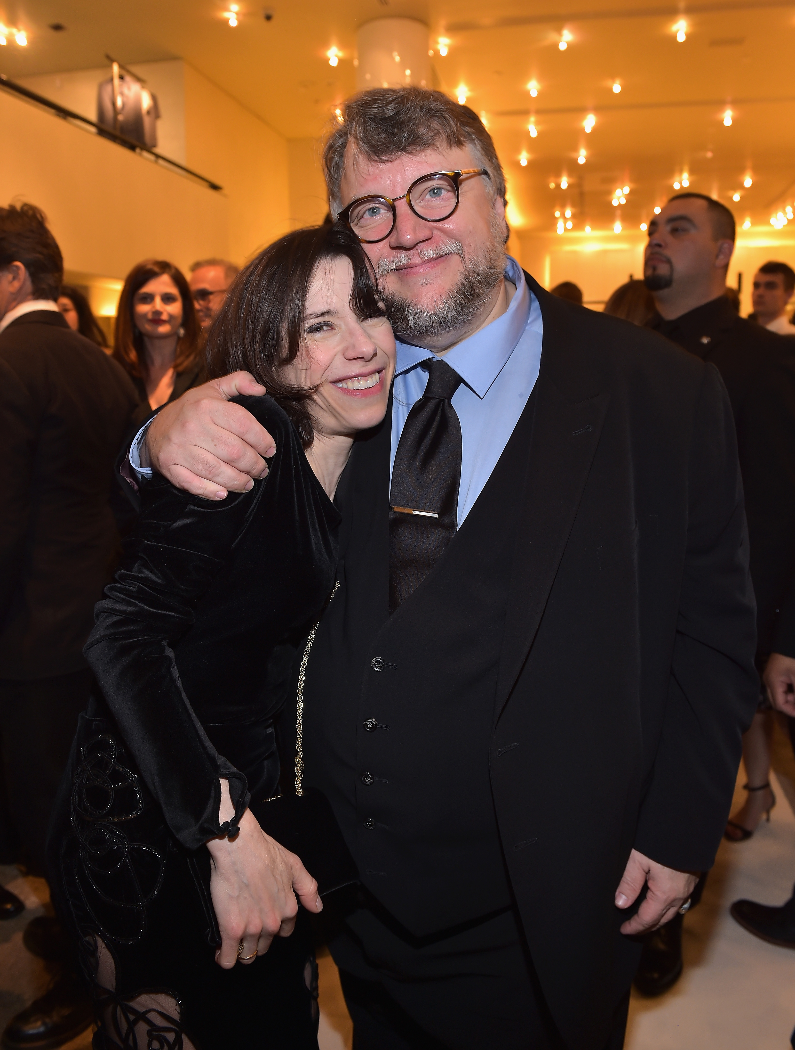 Sally Hawkins and Guillermo Del Toro pose at Giorgio Armani's celebration of "The Shape of Water," hosted by Roberta Armani, on March 3, 2018, in Beverly Hills, California | Source: Getty Images