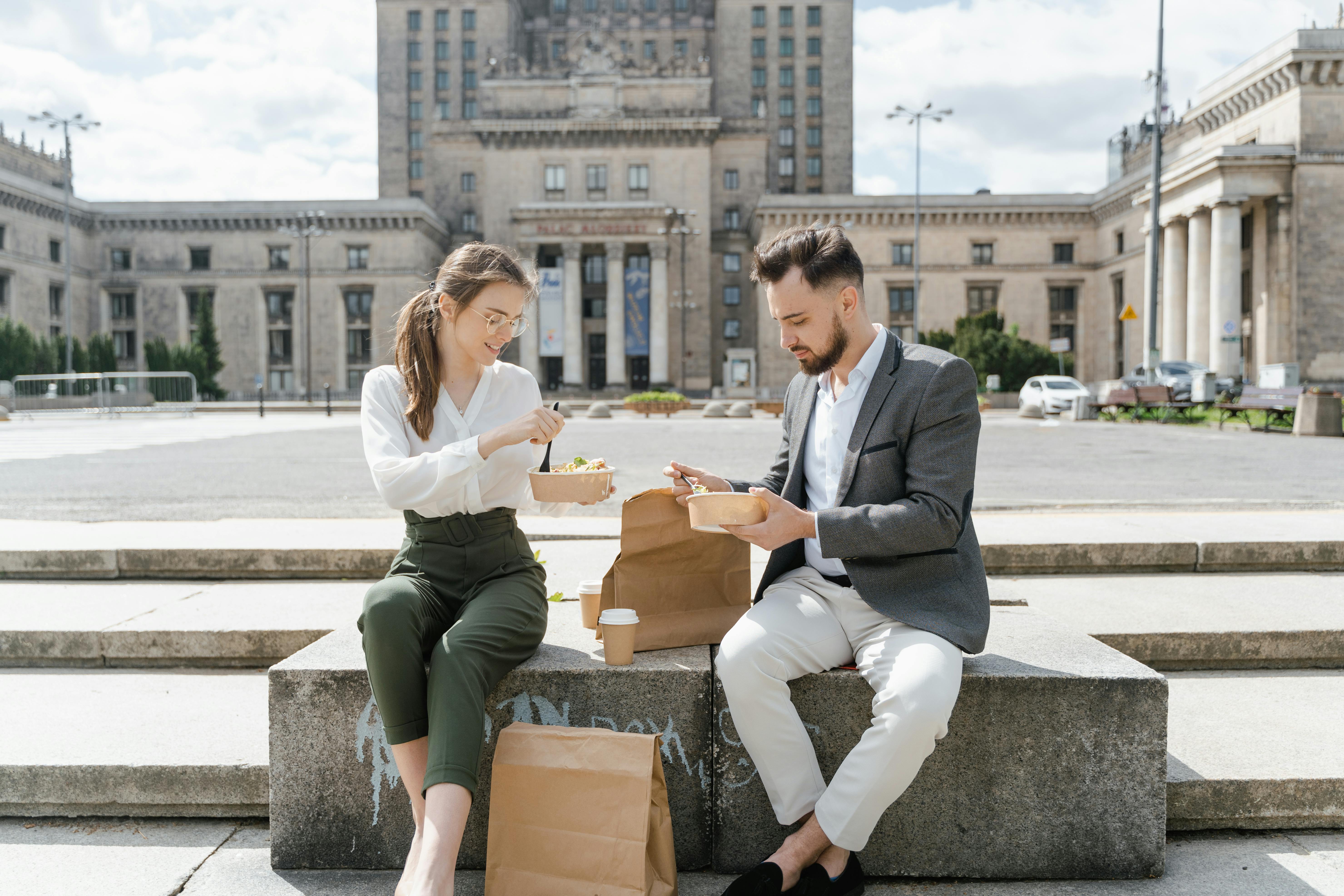 Co-workers eating lunch together | Source: Pexels