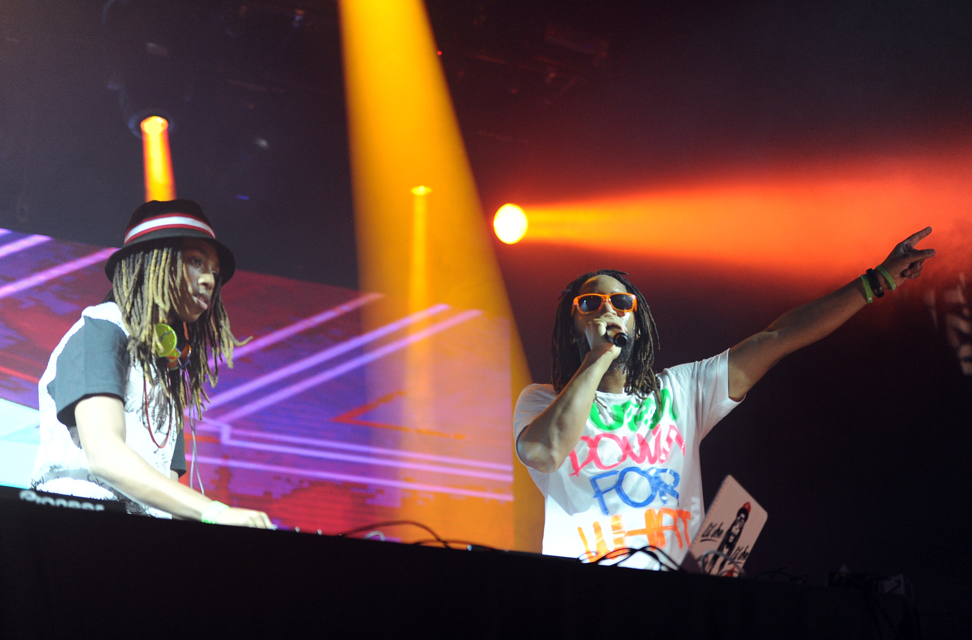 Rapper Jonathan Smith aka Lil Jon (L) and Nathan Smith aka DJ Young Slade perform onstage during 97.1 AMP RADIO's Amplify 2014 concert at the Hollywood Palladium in California on March 22. | Source: Getty Images