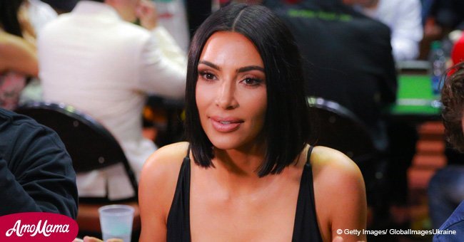 Kim Kardashian appears in a shiny transparent outfit barely covering her body