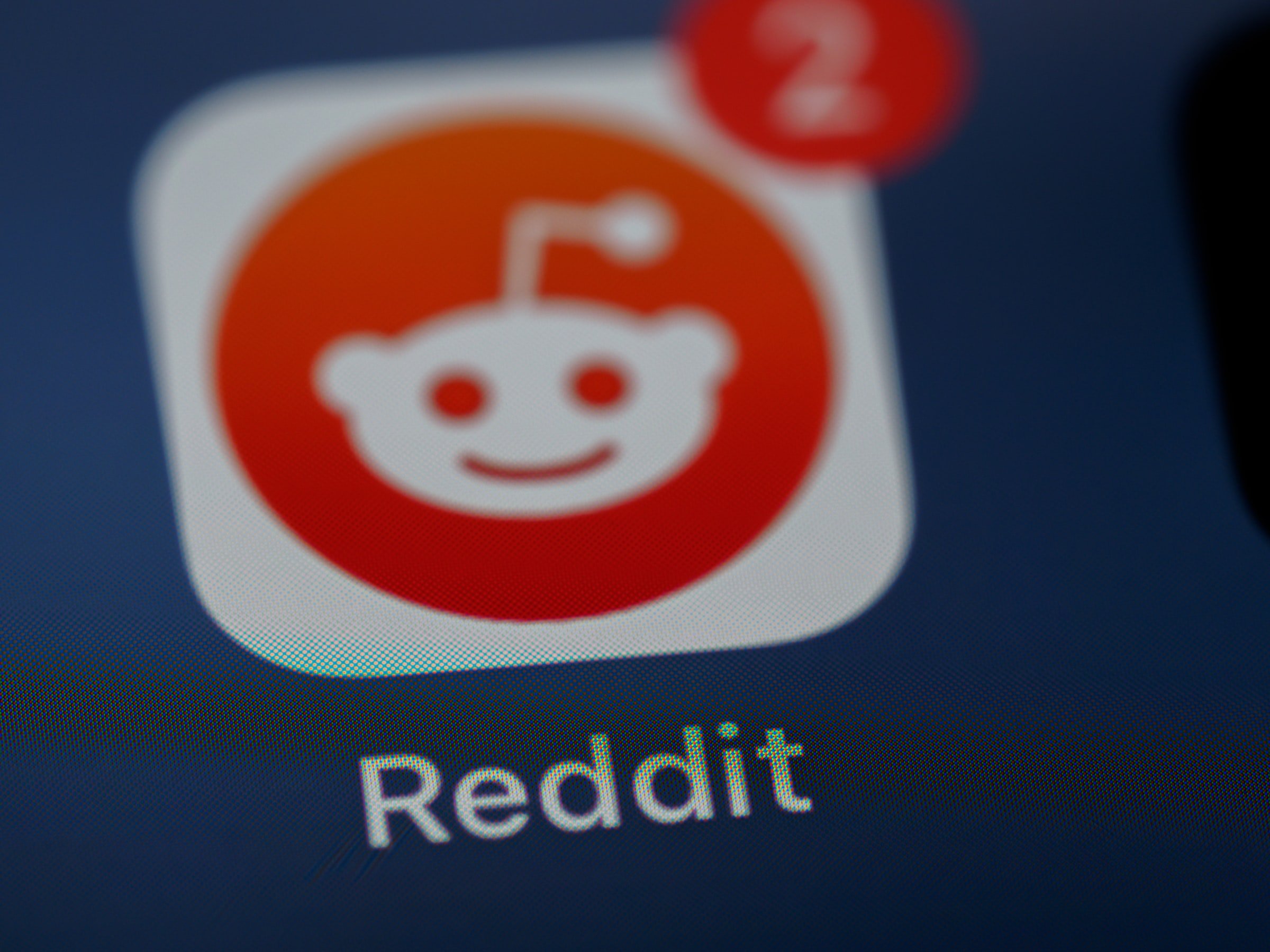 Reddit logo on a screen. | Source: Unsplash