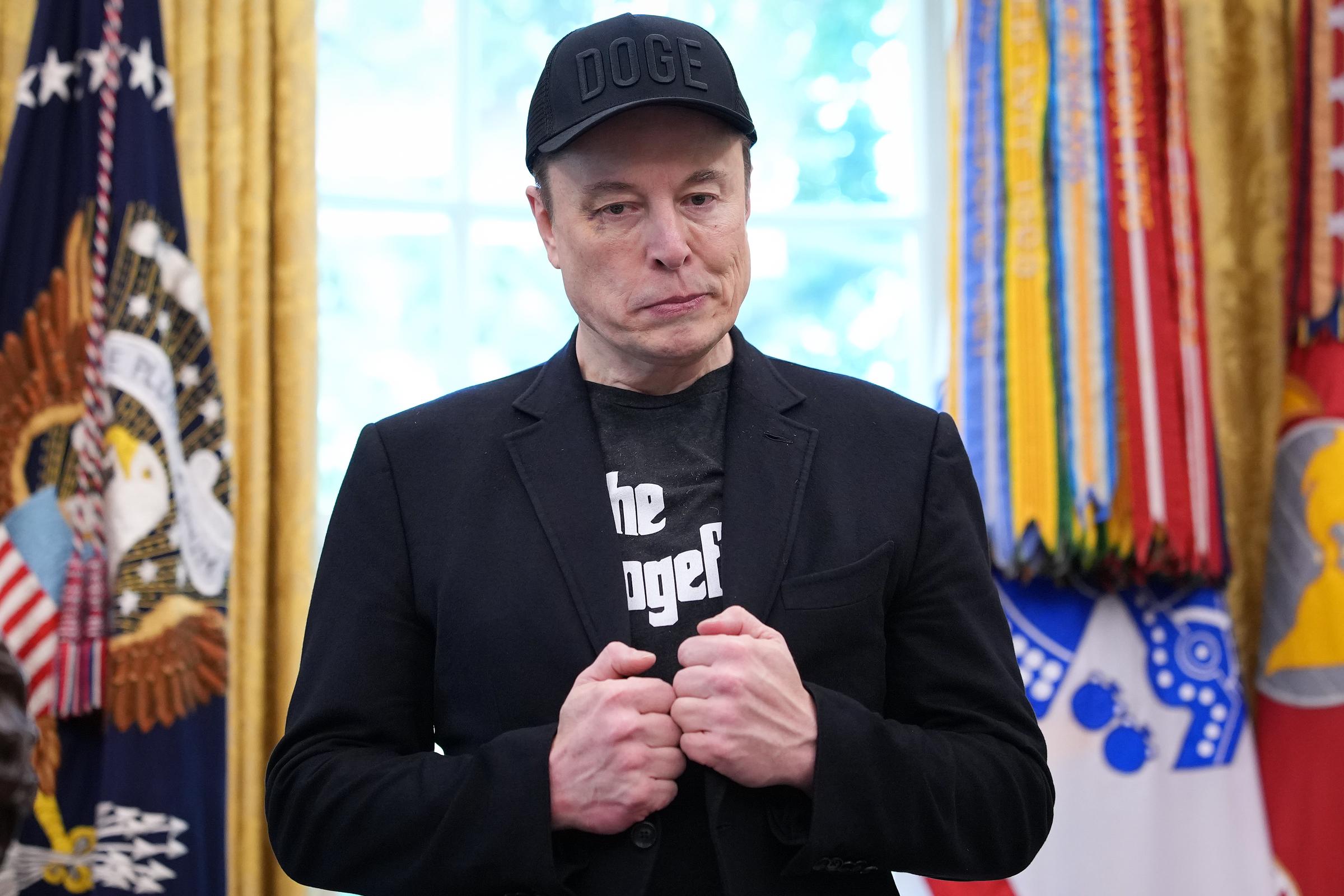 With a purplish mark at the corner of his eye, Musk’s unexpected appearance quickly became the focus of Friday's farewell conference.