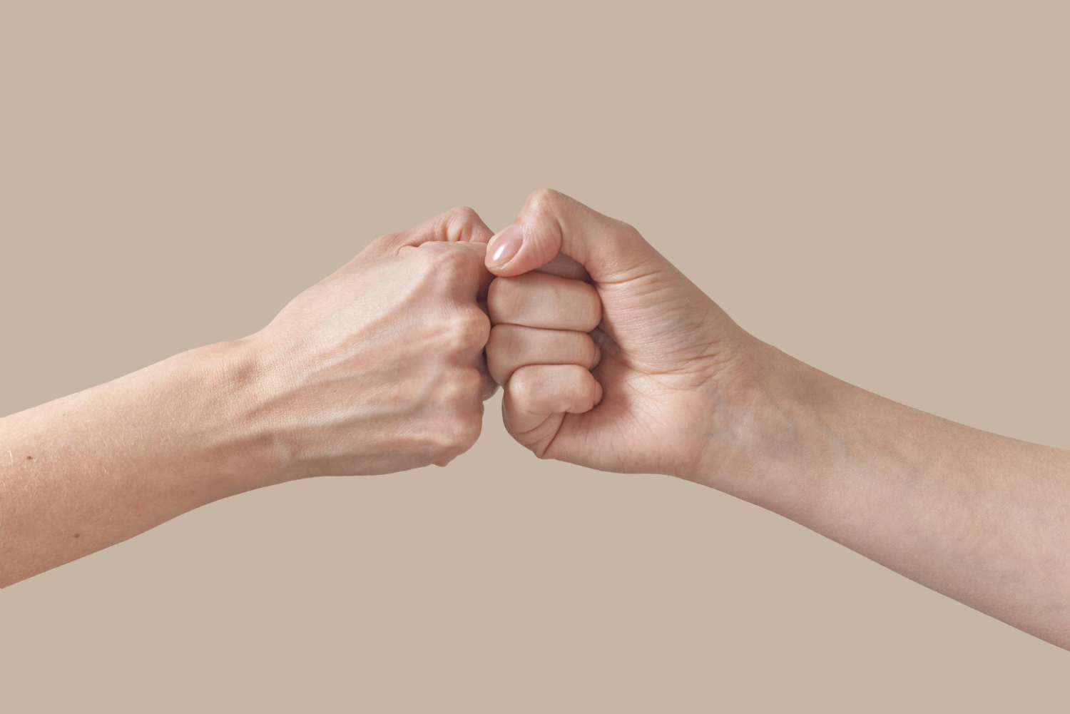 Two people bumping their fists | Source: Freepik