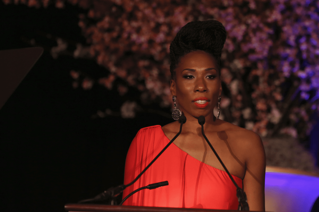 Brandi Harvey stands behind a podium during her speech at the "Steve & Marjorie Harvey Foundation Gala" on May 3, 2014, in Chicago, Illinois. | Source: Getty Images