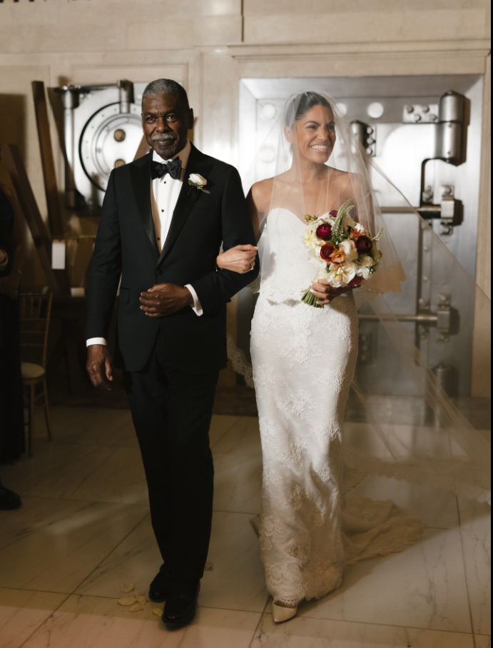 Alexis Lewis as a man in black suit walk with her, as seen from a post dated November 30, 2025. | Source: Facebook/CoryBooker