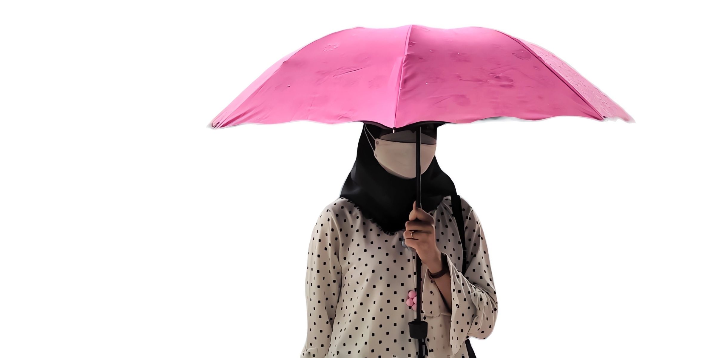 A person with a pink umbrella | Source: Shutterstock