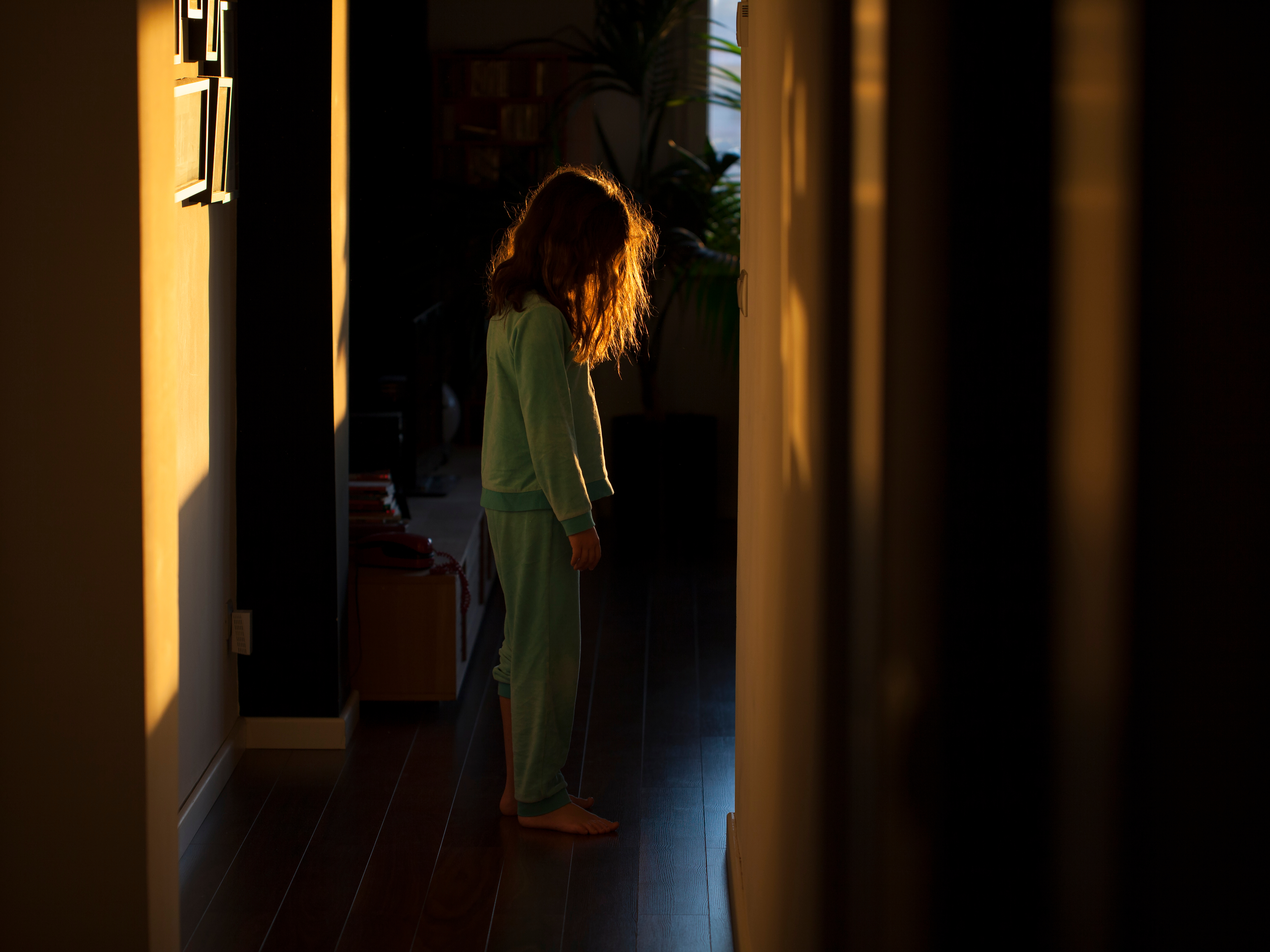 Sleepwalking little girl in the corridor. | Source: Shutterstock