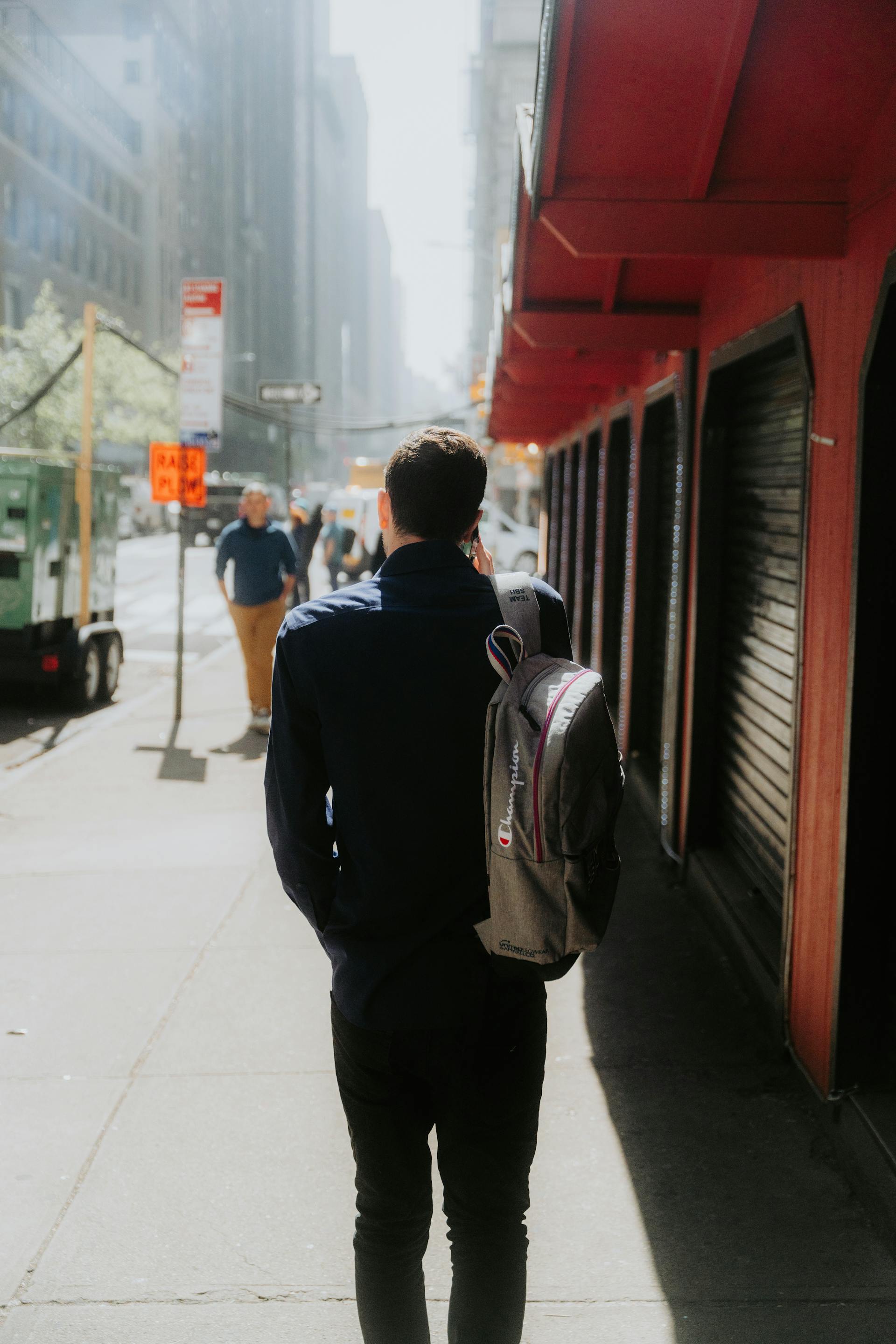 A man walking along a city street | Source: Pexels