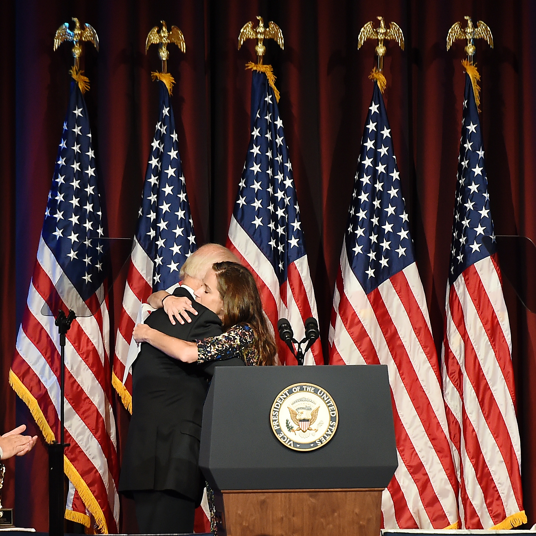 Joe Biden embraces daughter Ashley Biden on stage during the 75th Annual Father of the Year Awards Luncheon on June 14, 2016, in New York City. | Source: Getty Images