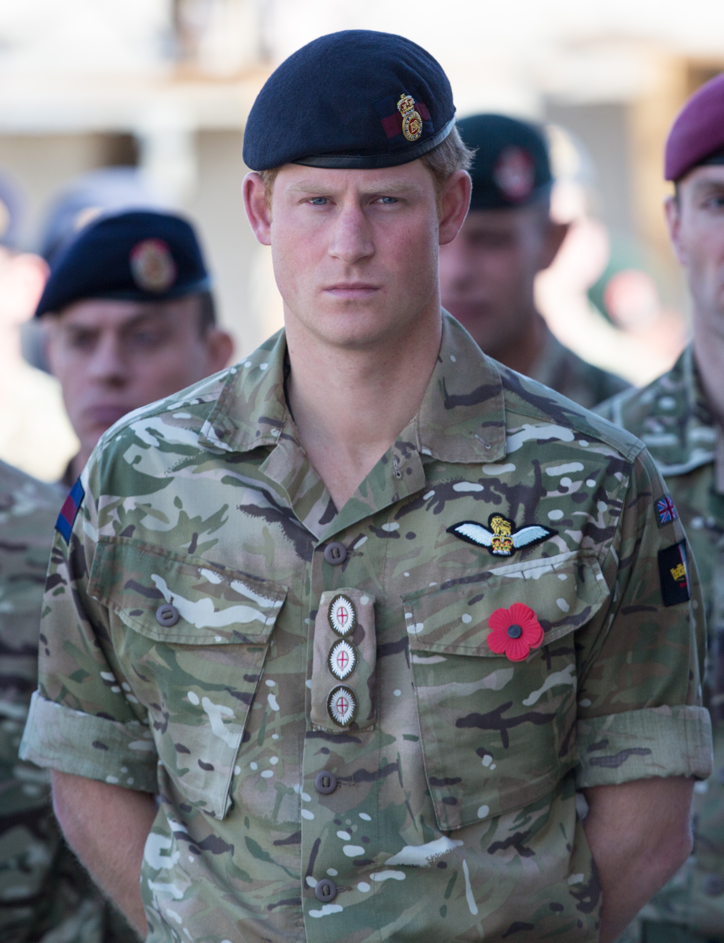 Prince Harry gathering with fellow service personnel for a Remembrance Sunday service at Kandahar Airfield in Kandahar, Afghanistan on November 9, 2014 | Source: Getty Images