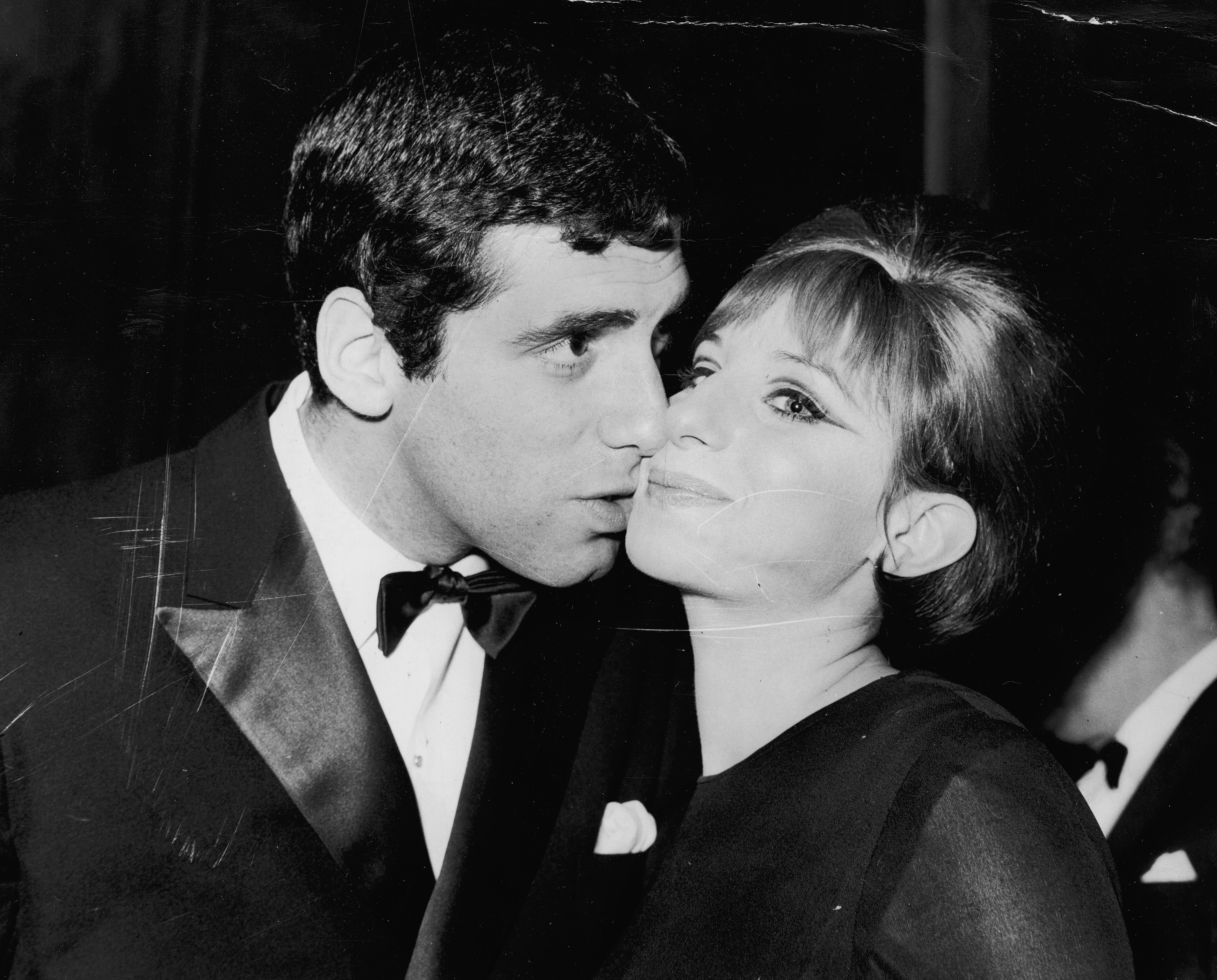 Us actress and singer, Barbra Streisand with her husband, actor Elliott Gould at the Prince of Wales Theatre in London on April 13, 1966 | Source: Getty Images