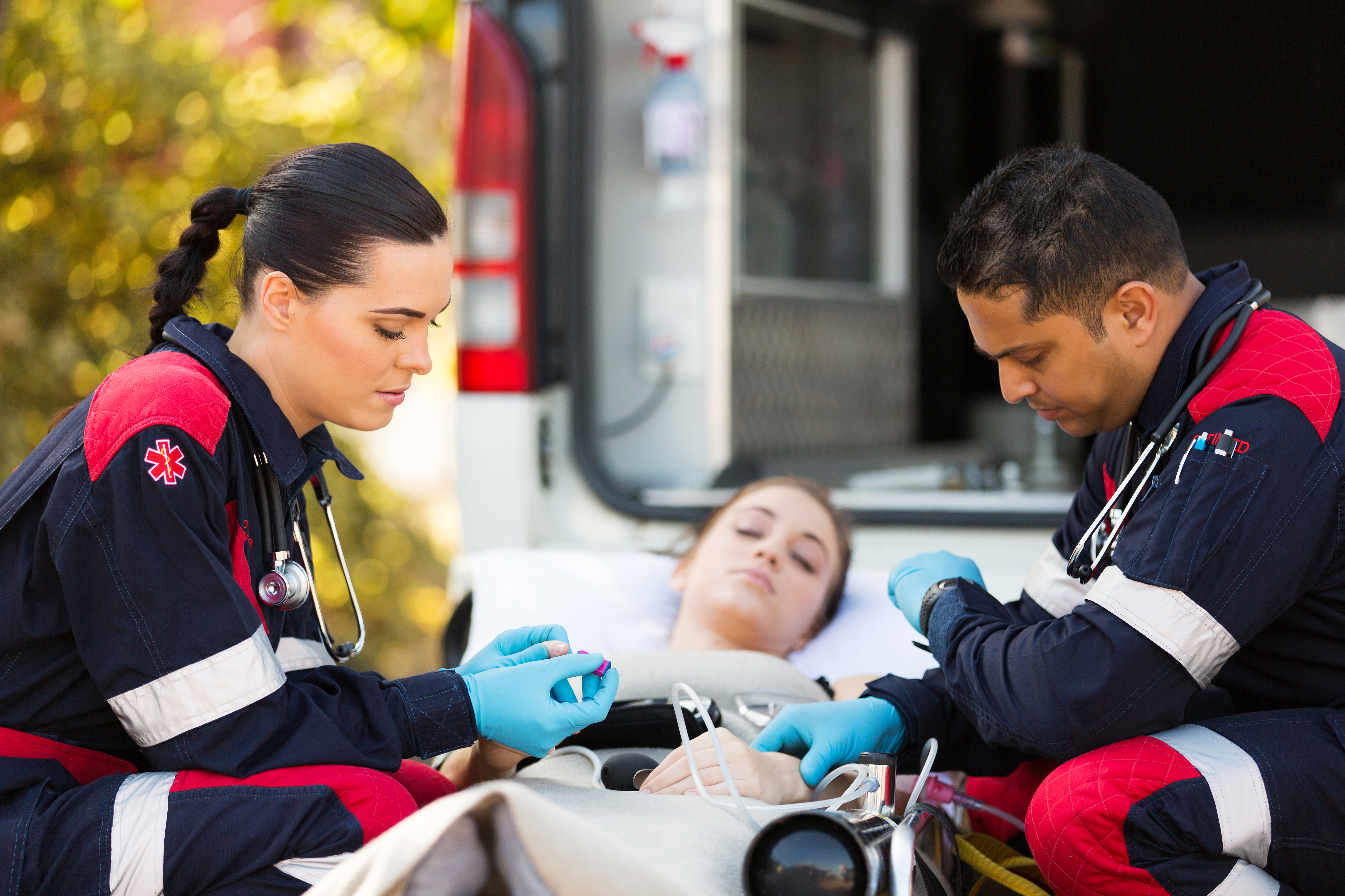 Paramedics giving first aid to a woman | Source: Shutterstock