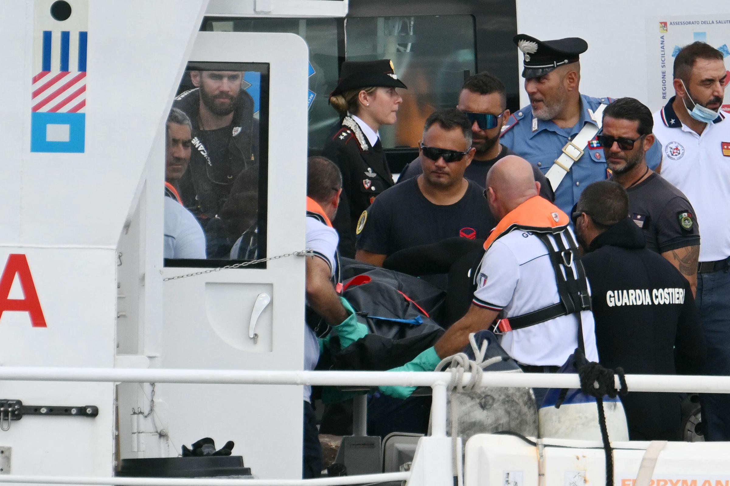 Italian Coast Guards (Guardia Costiera) carry a body in Porticello near Palermo, on August 21, 2024 two days after the British-flagged luxury yacht Bayesian sank. | Source: Getty Images