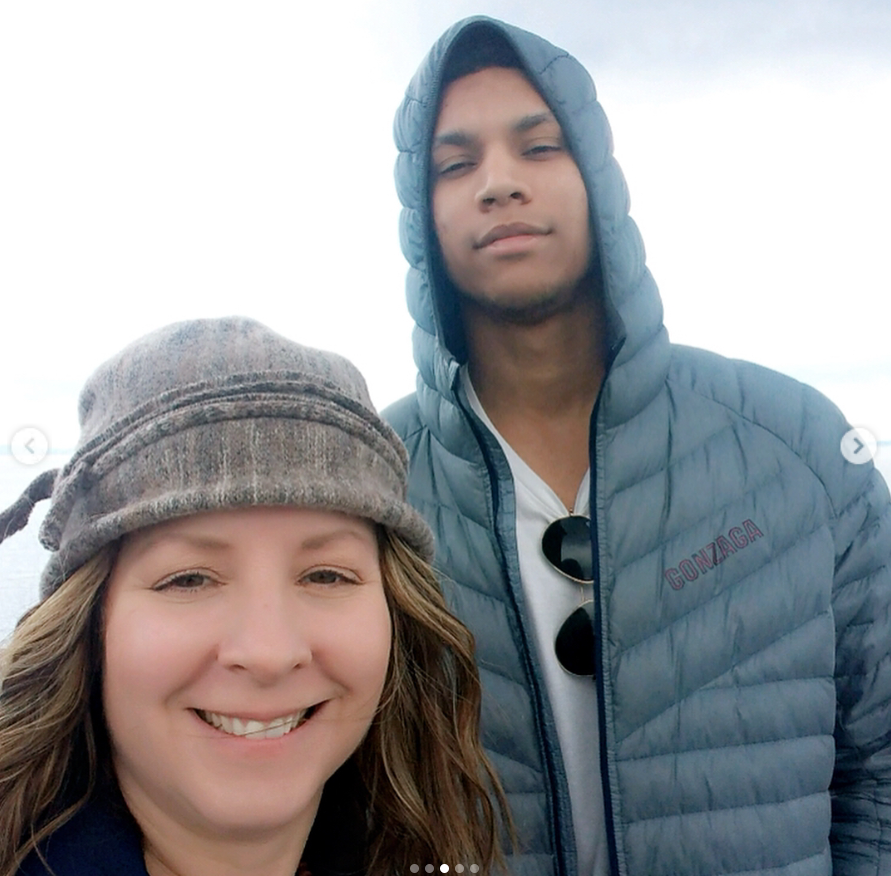 Brandon Clarke poses with his mother during an outdoor outing as the pair smile together in cool-weather clothing near the water. | Source: Instagram/brandon_clarke23