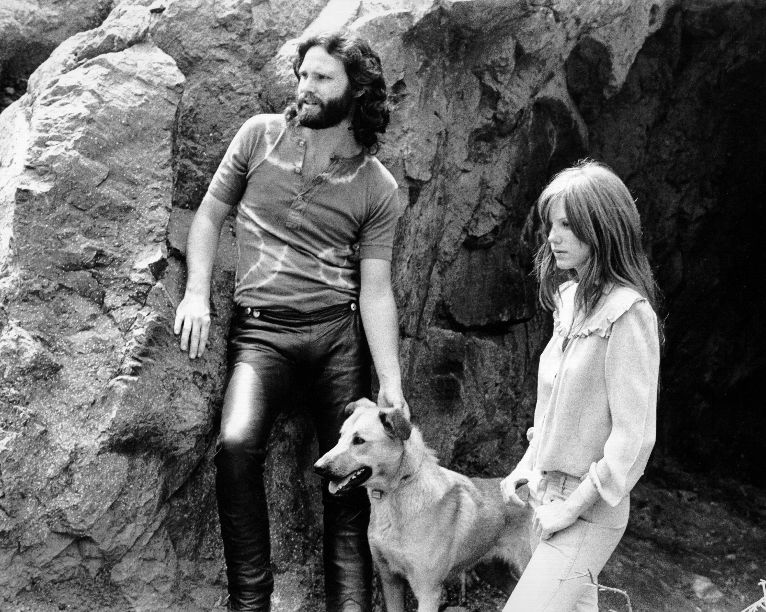 Singer Jim Morrison of The Doors with girlfriend Pamela Courson during a 1969 photo shoot at Bronson Caves in the Hollywood Hills, California. | Source: Getty Images