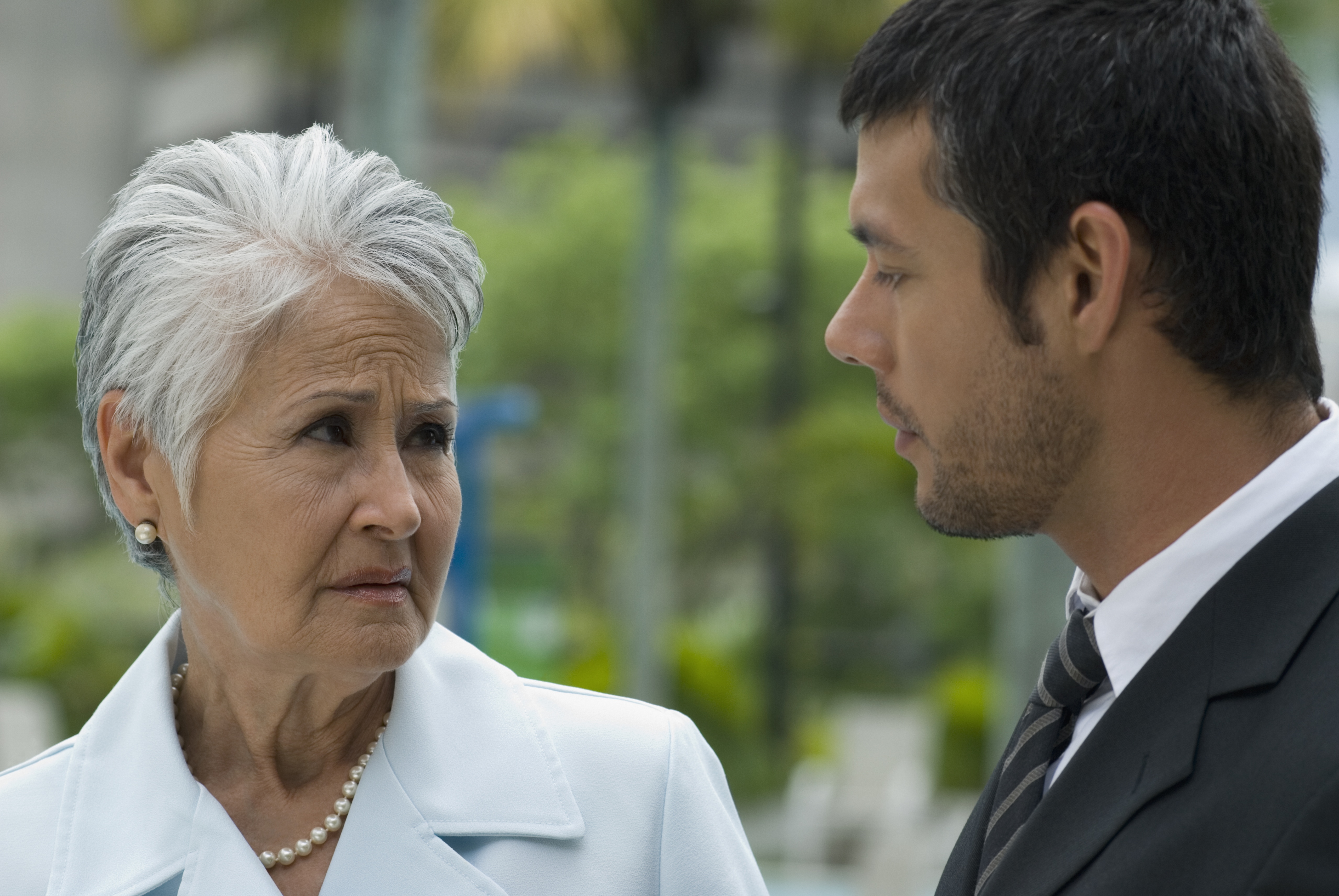 Hispanic mother and adult son talking | Source: Getty Images
