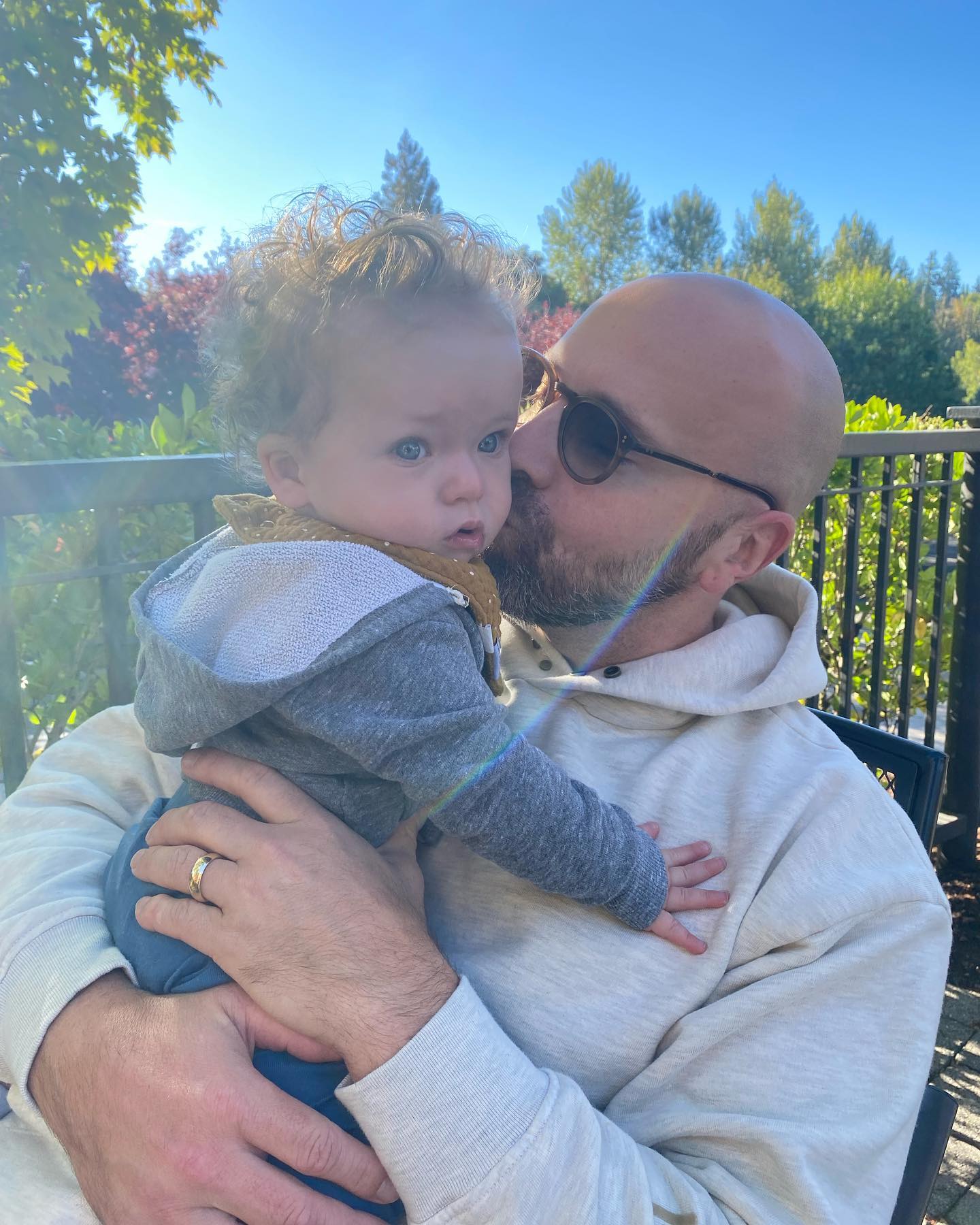Joe McCann holding and kissing one of his children, posted on November 15, 2021. | Source: Facebook/Joe McCann
