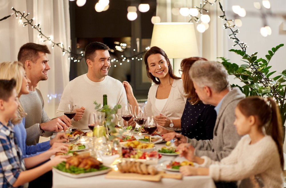 Happy family having Thanksgiving dinner party at home. | Photo: Shutterstock