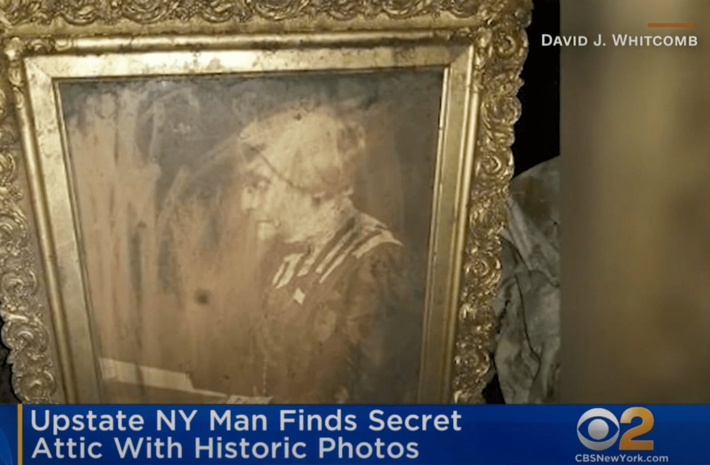In a hidden attic in New York, a man found an old framed photograph of Susan B. Anthony | Photo: Youtube/CBS New York