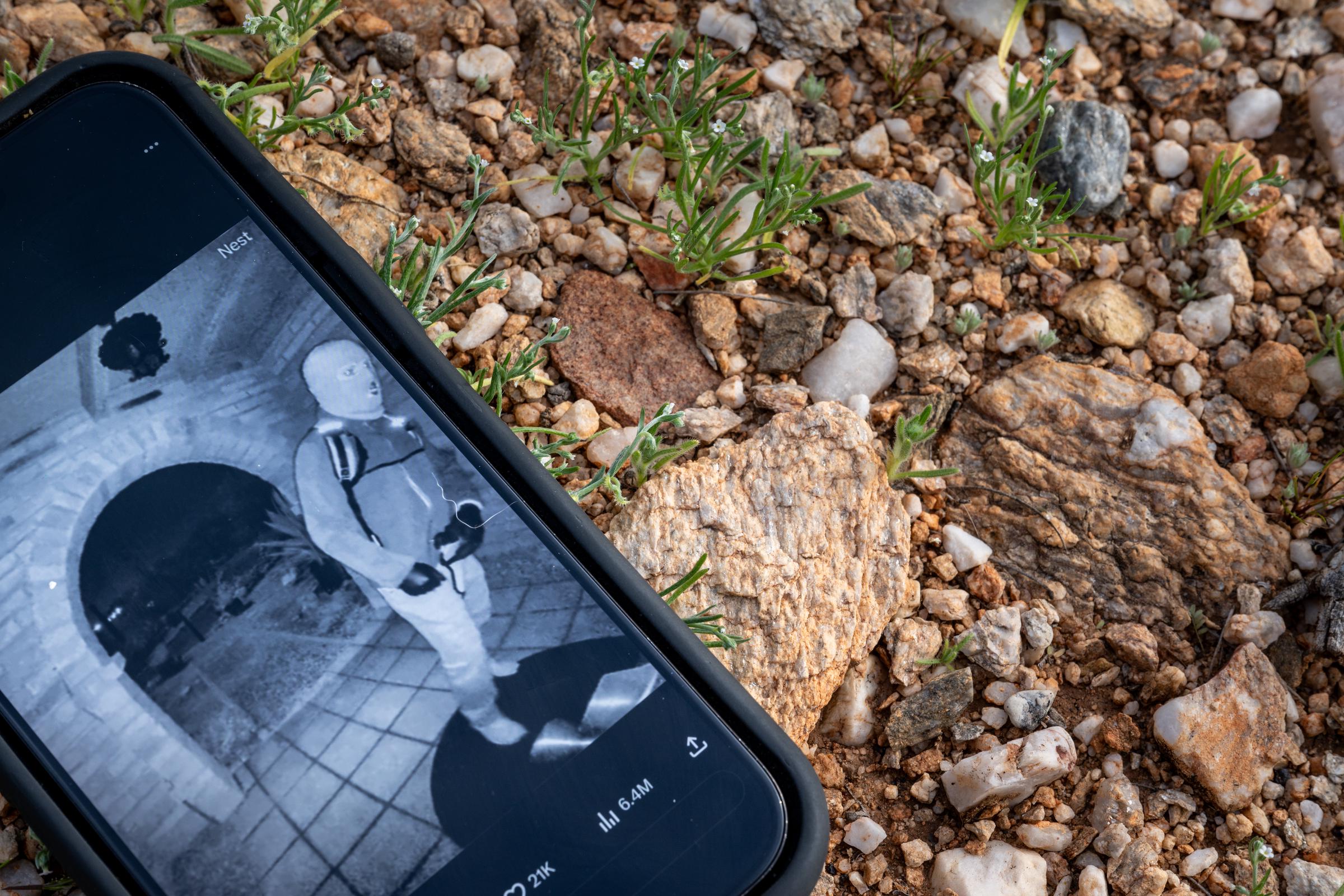 In this photo illustration, Nancy Guthrie's alleged kidnapper is seen on FBI Director Kash Patel's X account on a cellular phone, on February 10, 2026, in Tucson, Arizona | Source: Getty Images