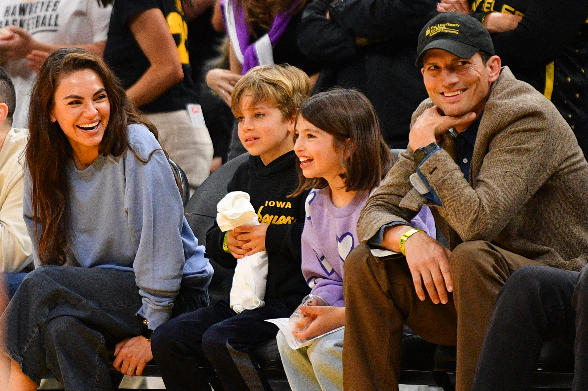 Mila Kunis, Ashton Kutcher and their children, Wyatt and Dimitri Kutcher, during the WNBA basketball game in Los Angeles, California on May 24, 2024 | Source: Getty Images
