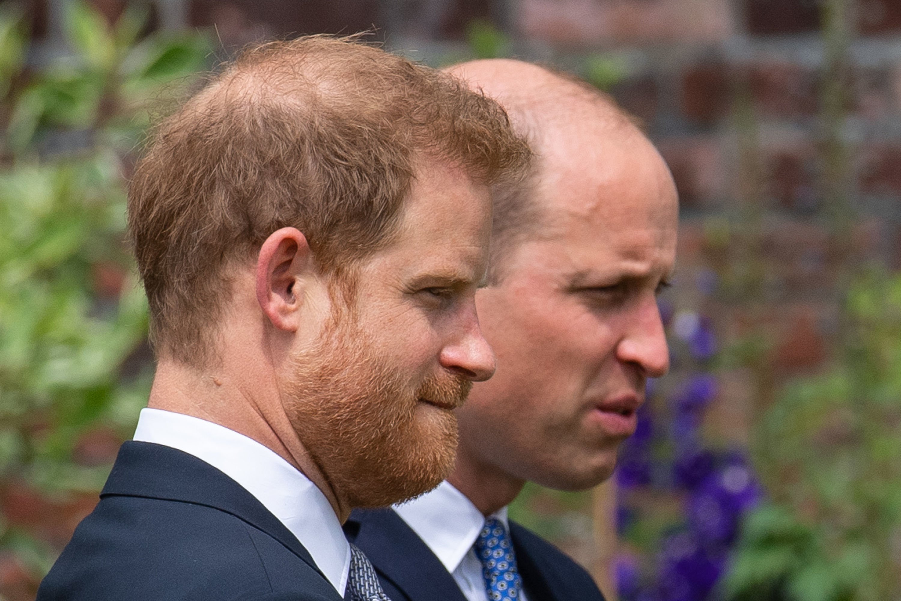 Prince Harry and Prince William during the unveiling of a statue of their mother, Princess Diana, at Kensington Palace, on July 1, 2021, in London, England. | Source: Getty Images