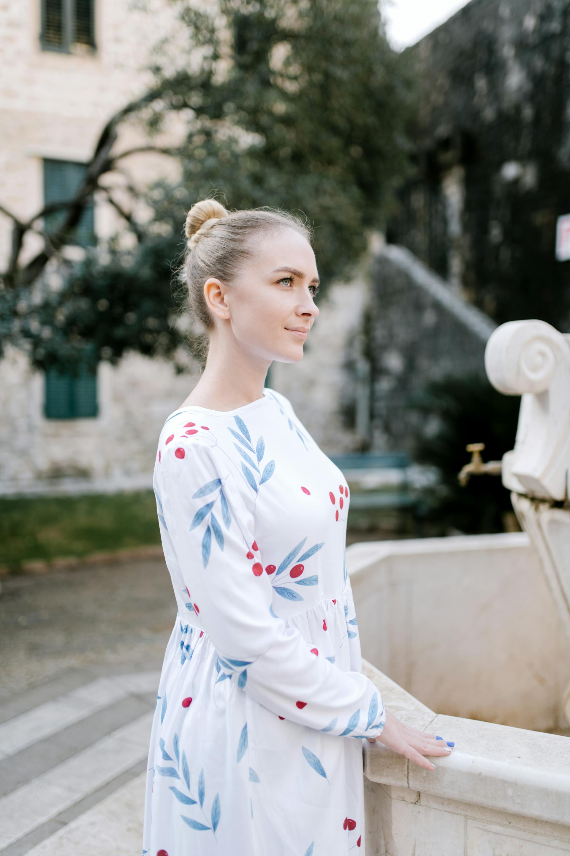 A woman standing near a stone structure and looking at someone | Source: Pexels