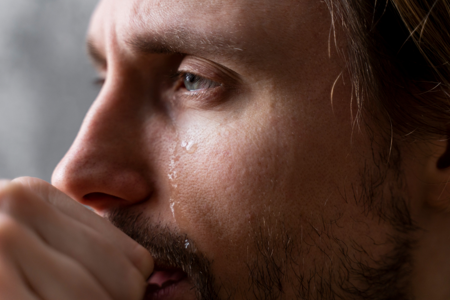An emotional man in tears | Source: Freepik